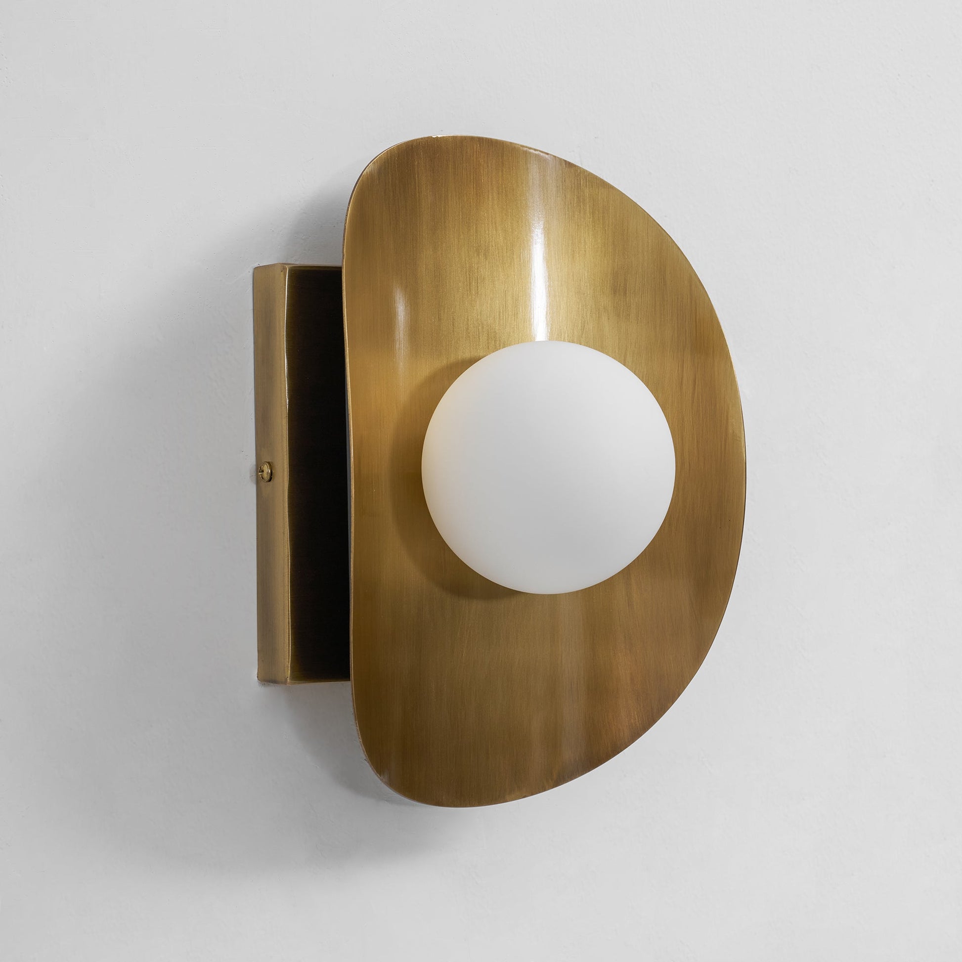 The interplay of light and shadow created by the Hopper Wall Lamp.