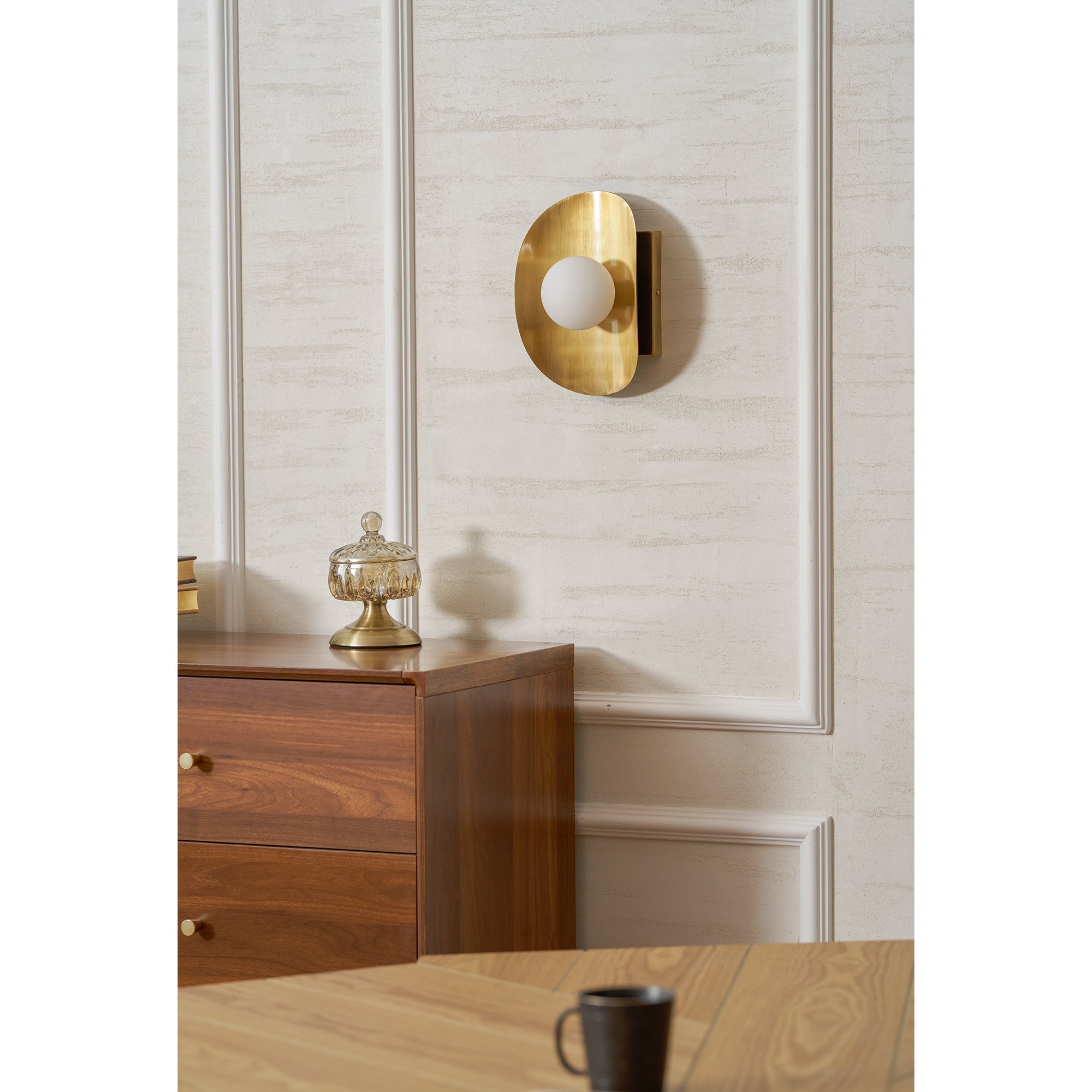 Hopper Wall Lamp illuminating a space with a warm glow.