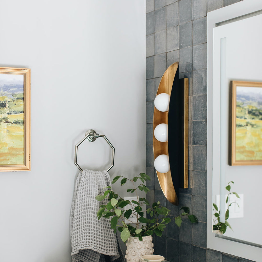 Lifestyle image of the Hopper Wall Lamp in a hallway.