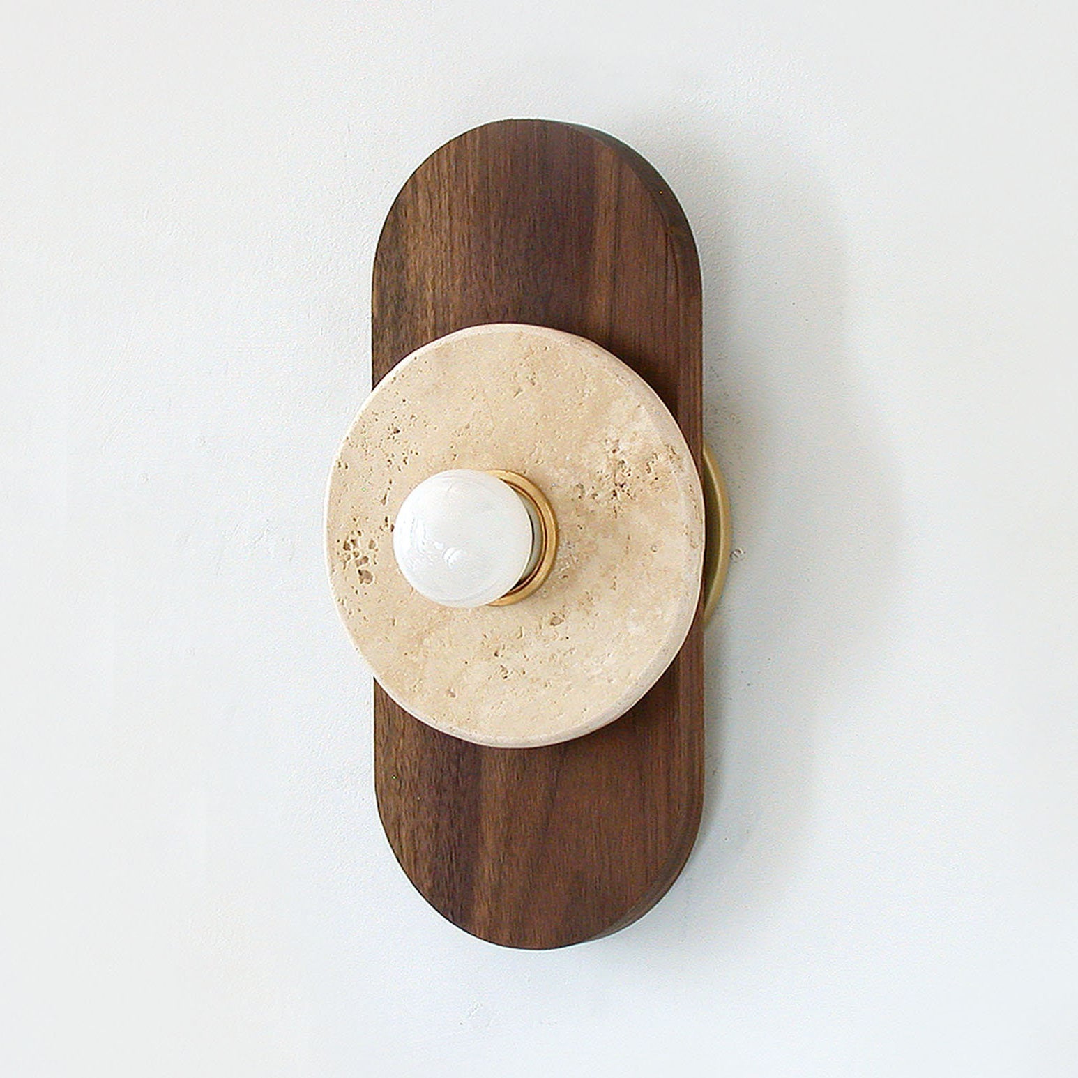 Top-down view of the Horizon Travertine Wall Sconce.