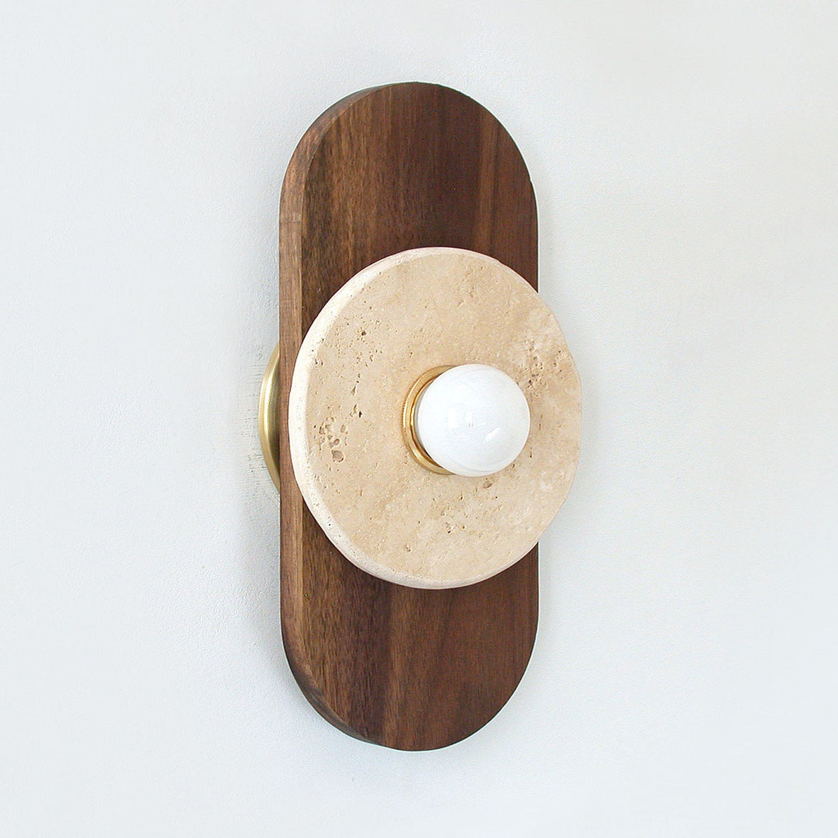 Lifestyle image of the sconce in a sophisticated living room.