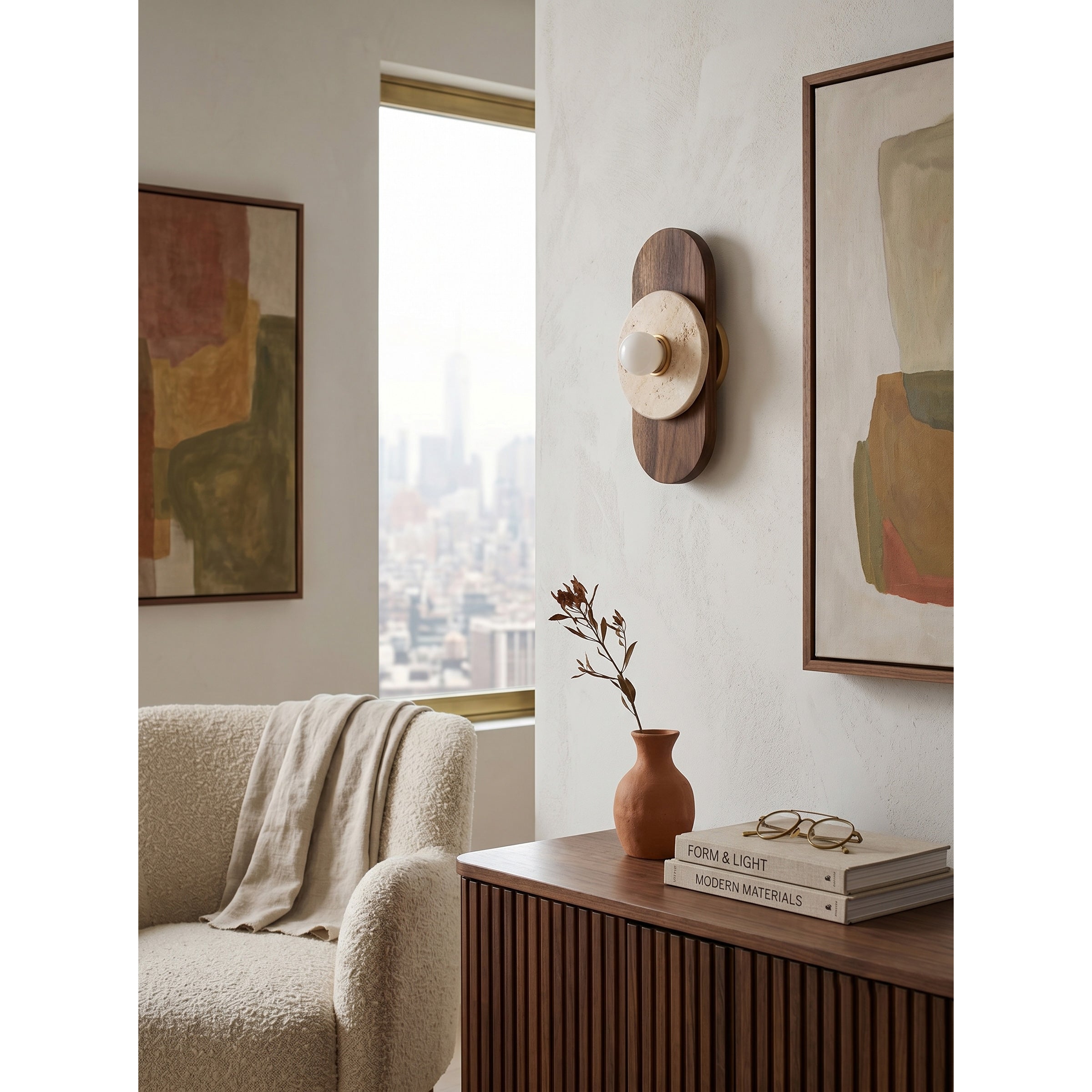 The wall sconce illuminated, casting a soft, atmospheric glow.