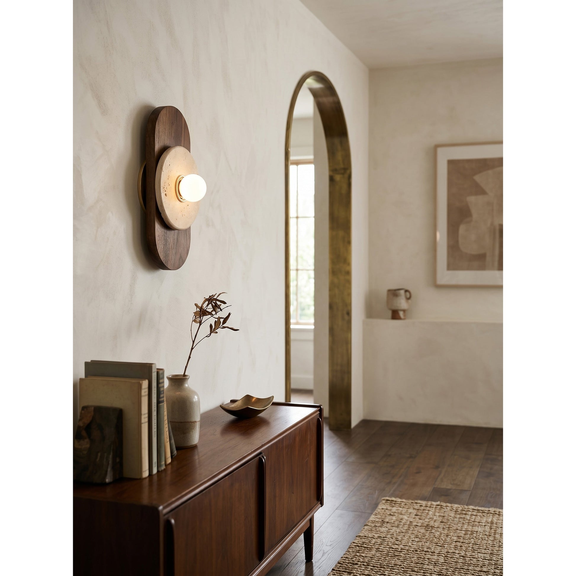 Horizon Travertine Wall Sconce styled in a minimalist entryway.