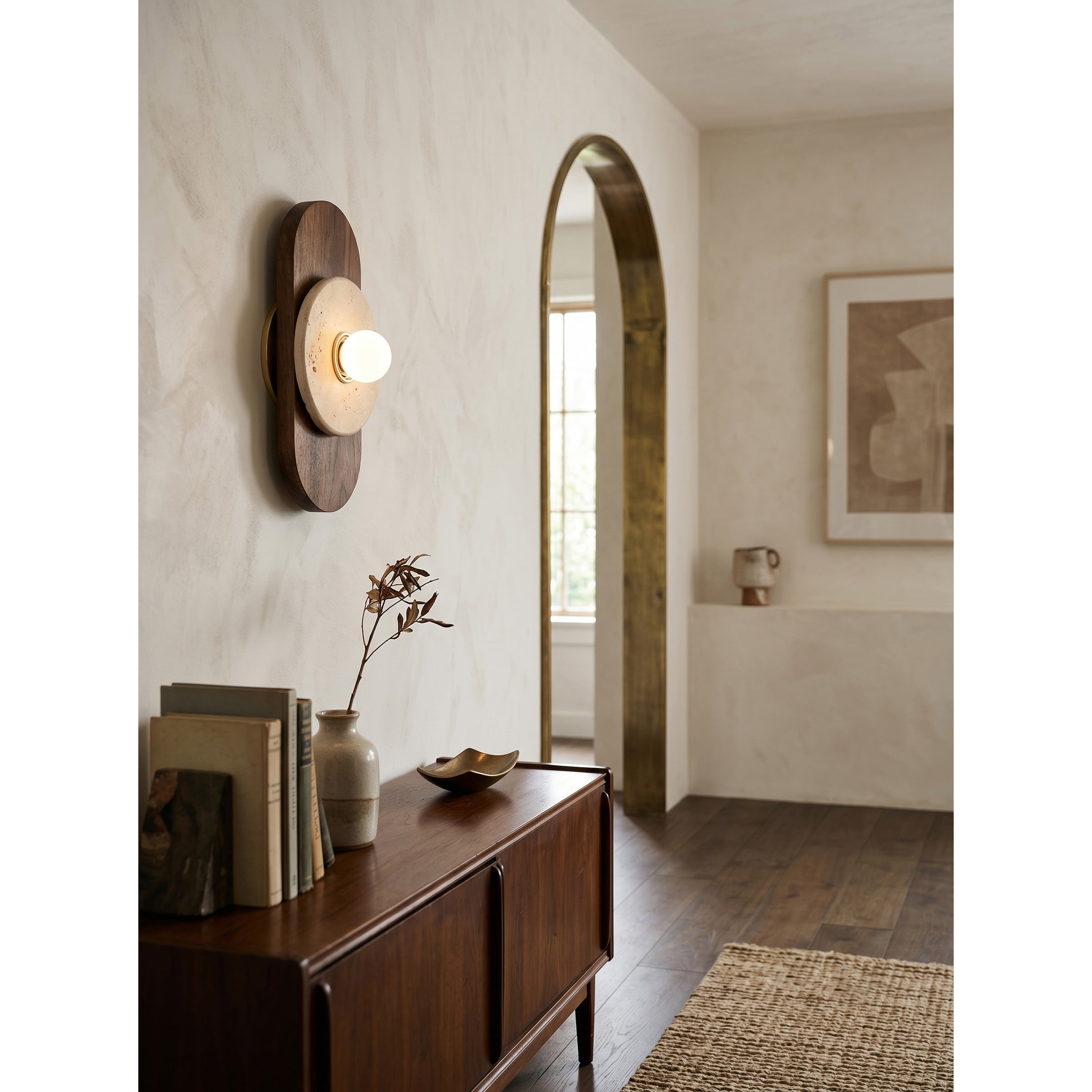 Horizon Travertine Wall Sconce styled in a minimalist entryway.
