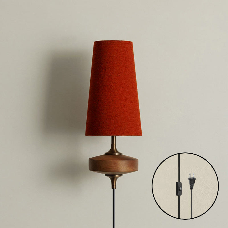 The Hour Rho lamp turned on, casting a soft, diffused glow through the fabric shade.