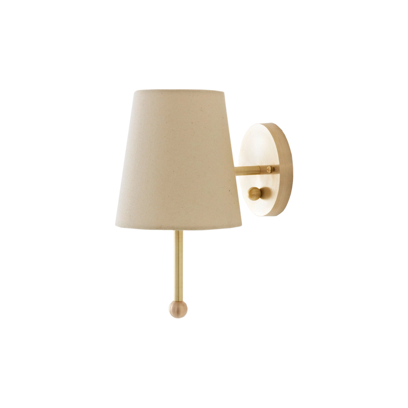 Contemporary brass wall lamp with a linen shade against a plain wall.