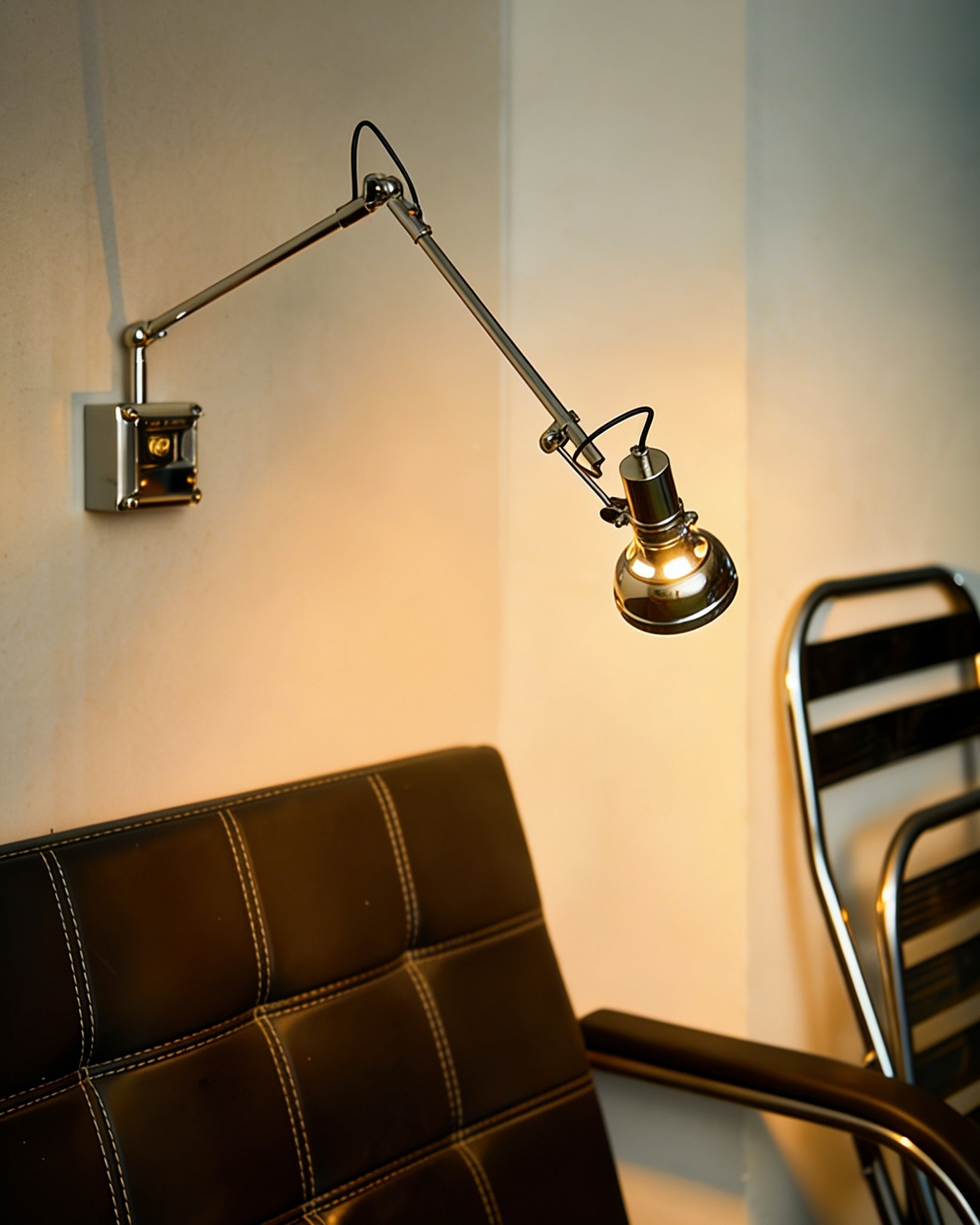 The sconce retracted against a wall as a sculptural piece