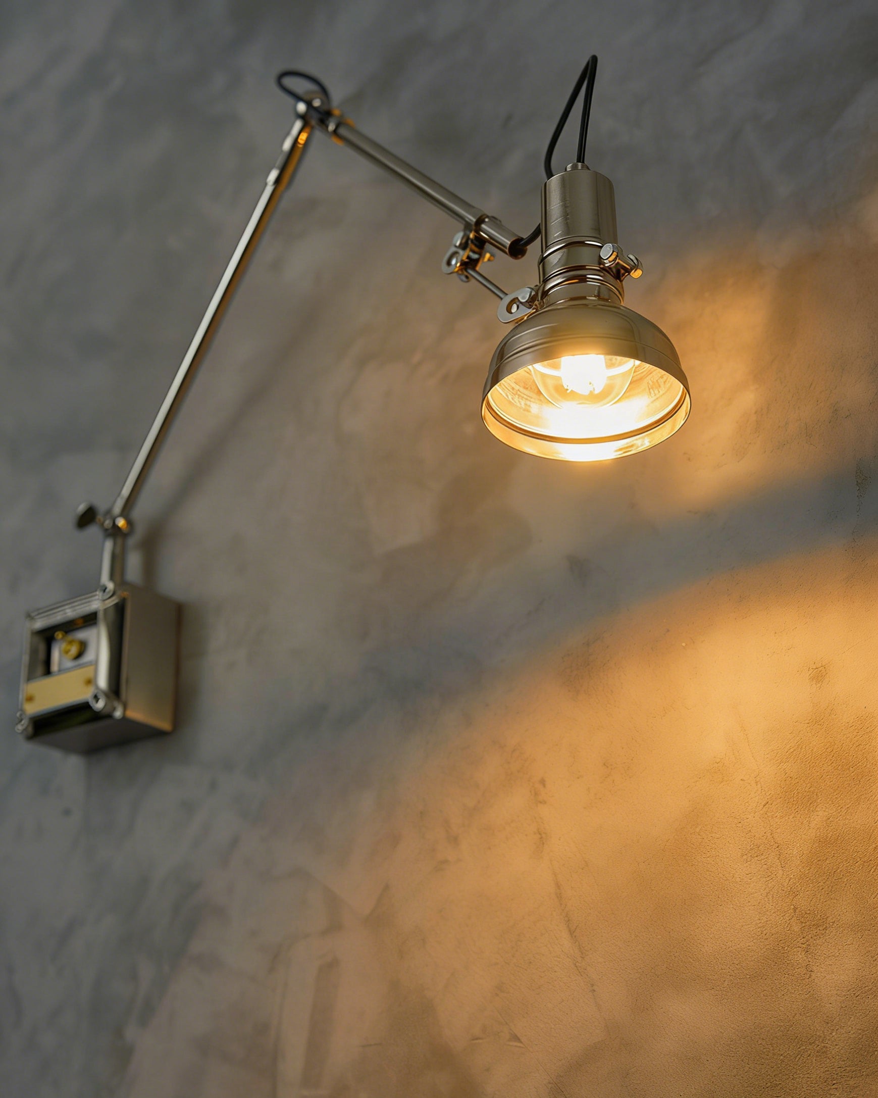 Hudson sconce providing task lighting over a drafting table