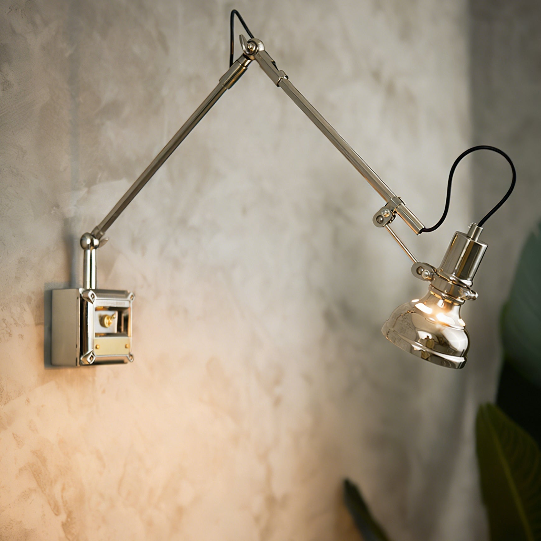 Side view of the Hudson sconce showing its adjustable arm
