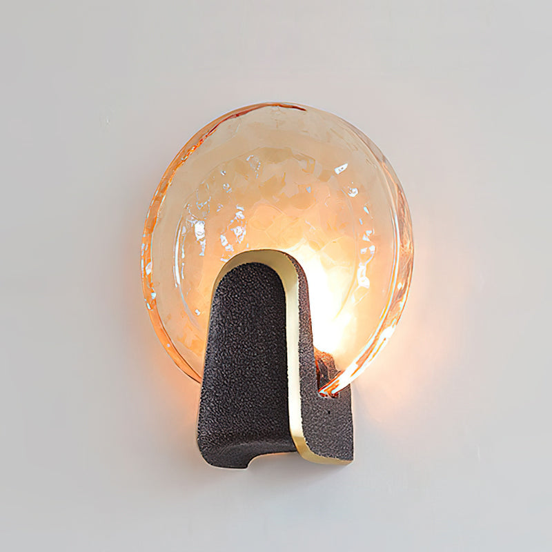The clear glass Ingot Wall Lamp providing ambient light in a room.