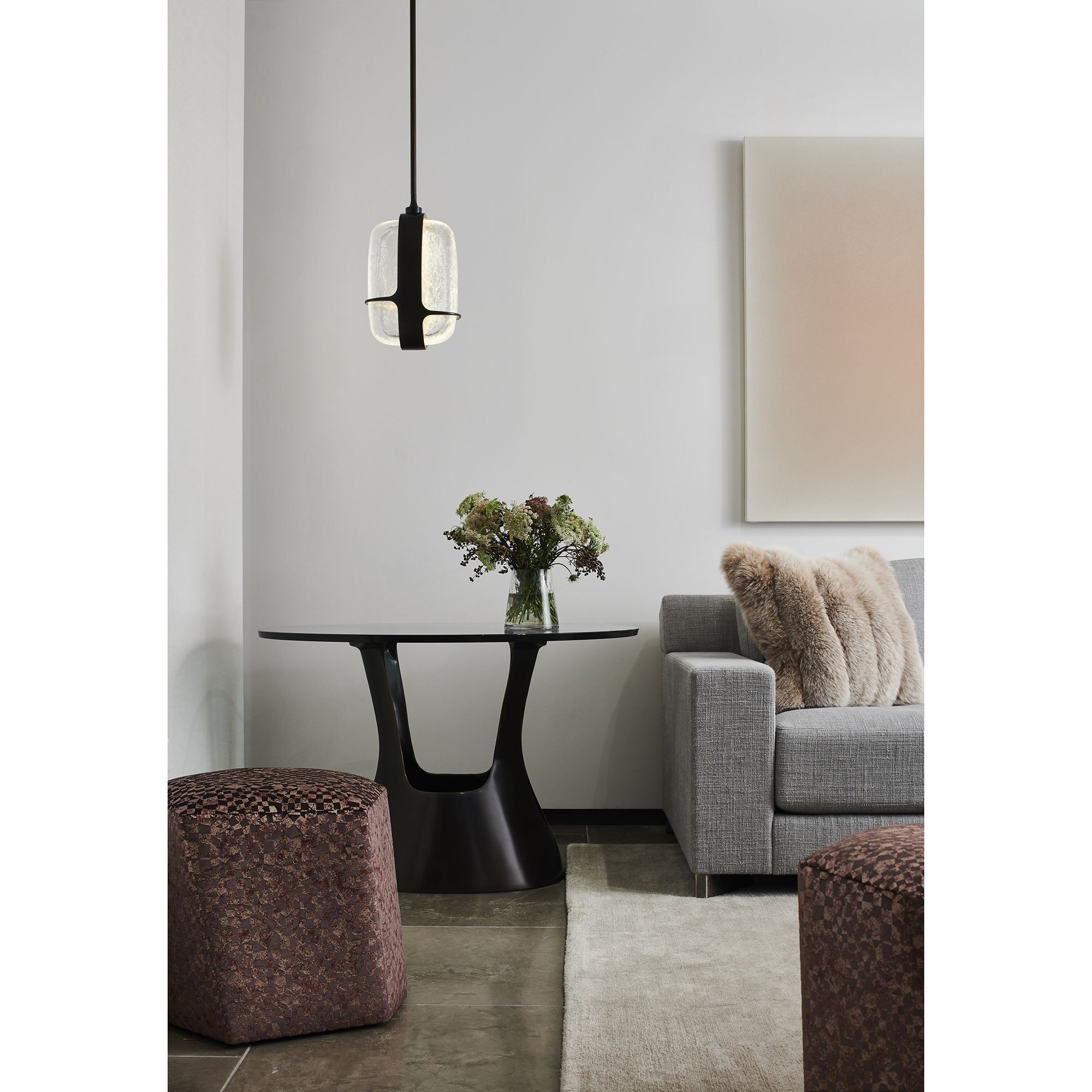The orb-like glow radiating from the Iris Pendant Lamp.