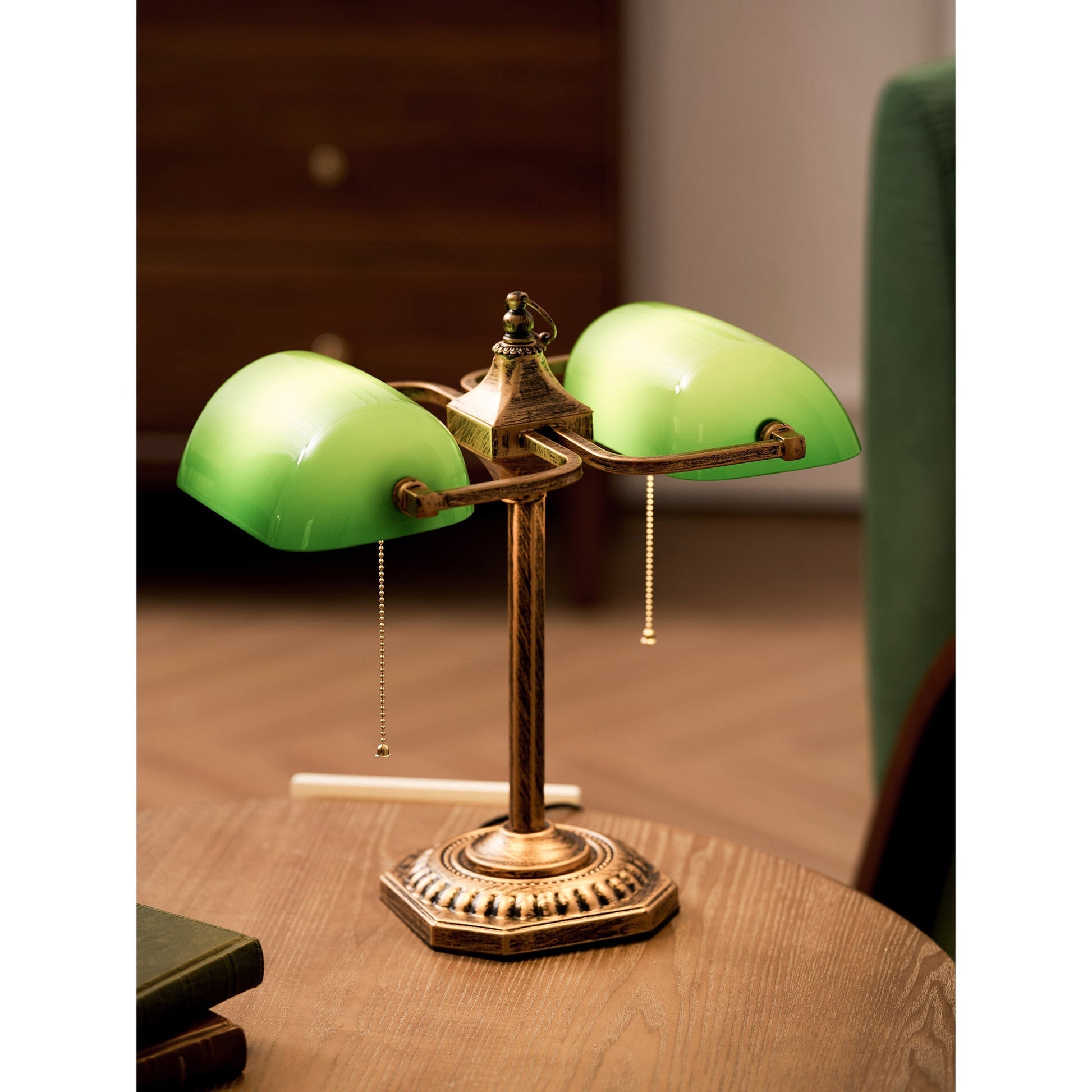 The lamp shown with books to indicate its library style.