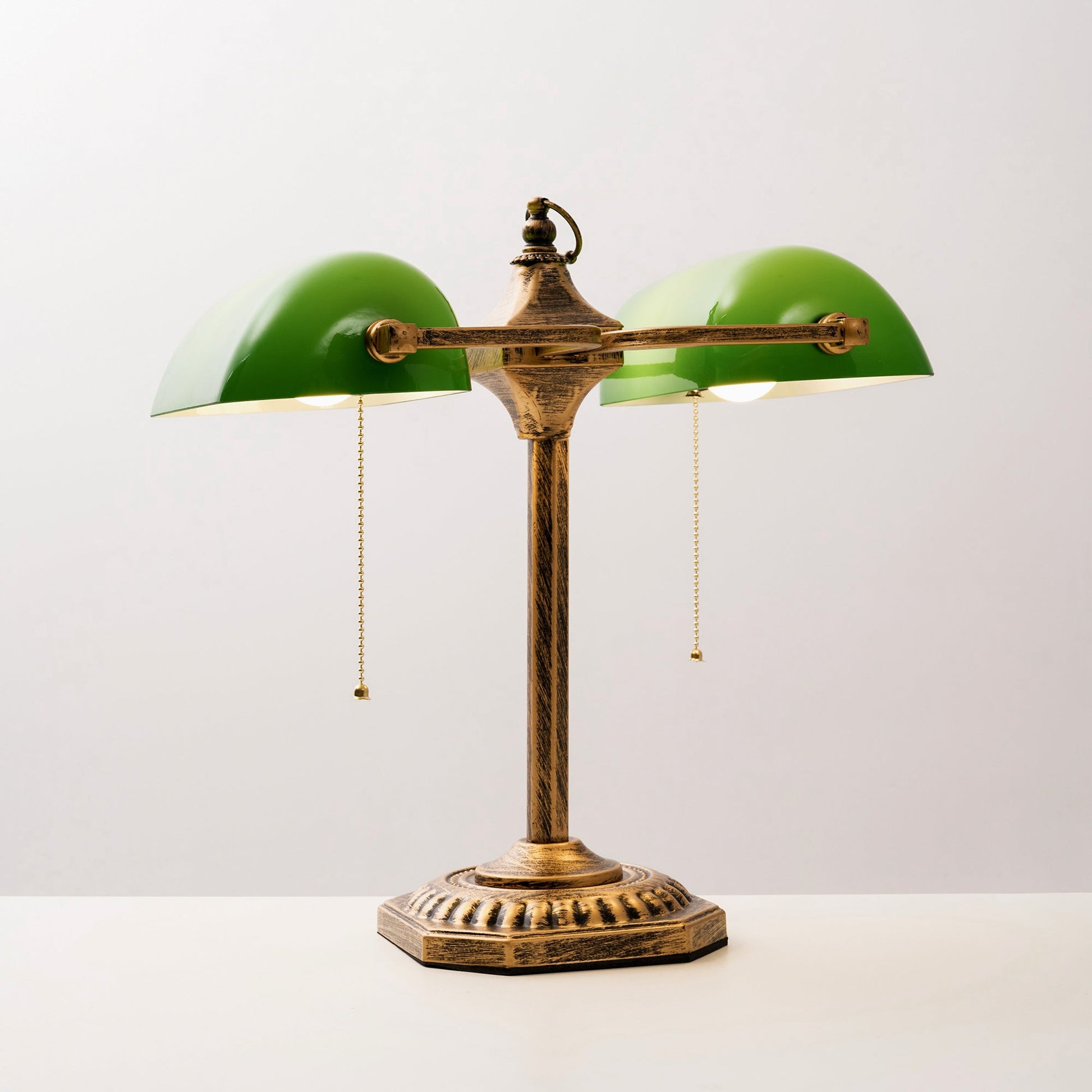 Lifestyle image of the lamp on a side table next to a chair.