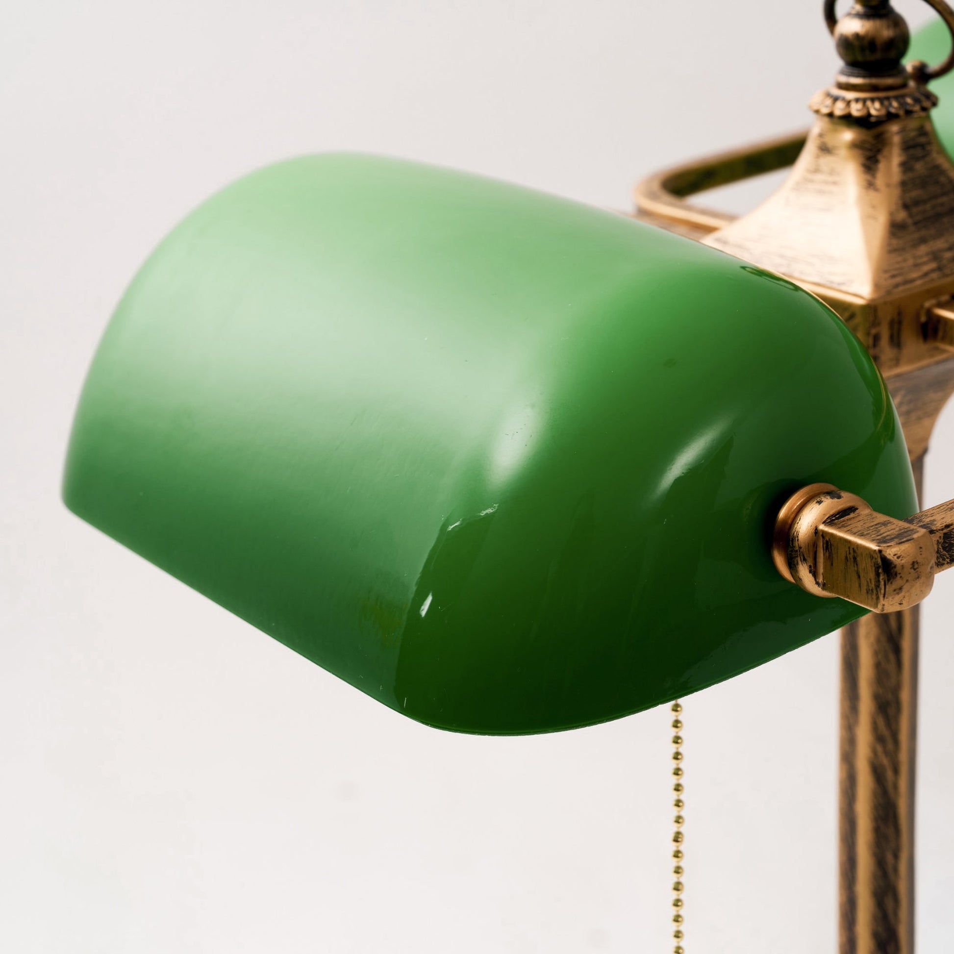 Another angle of the lamp on a dark wood desk.