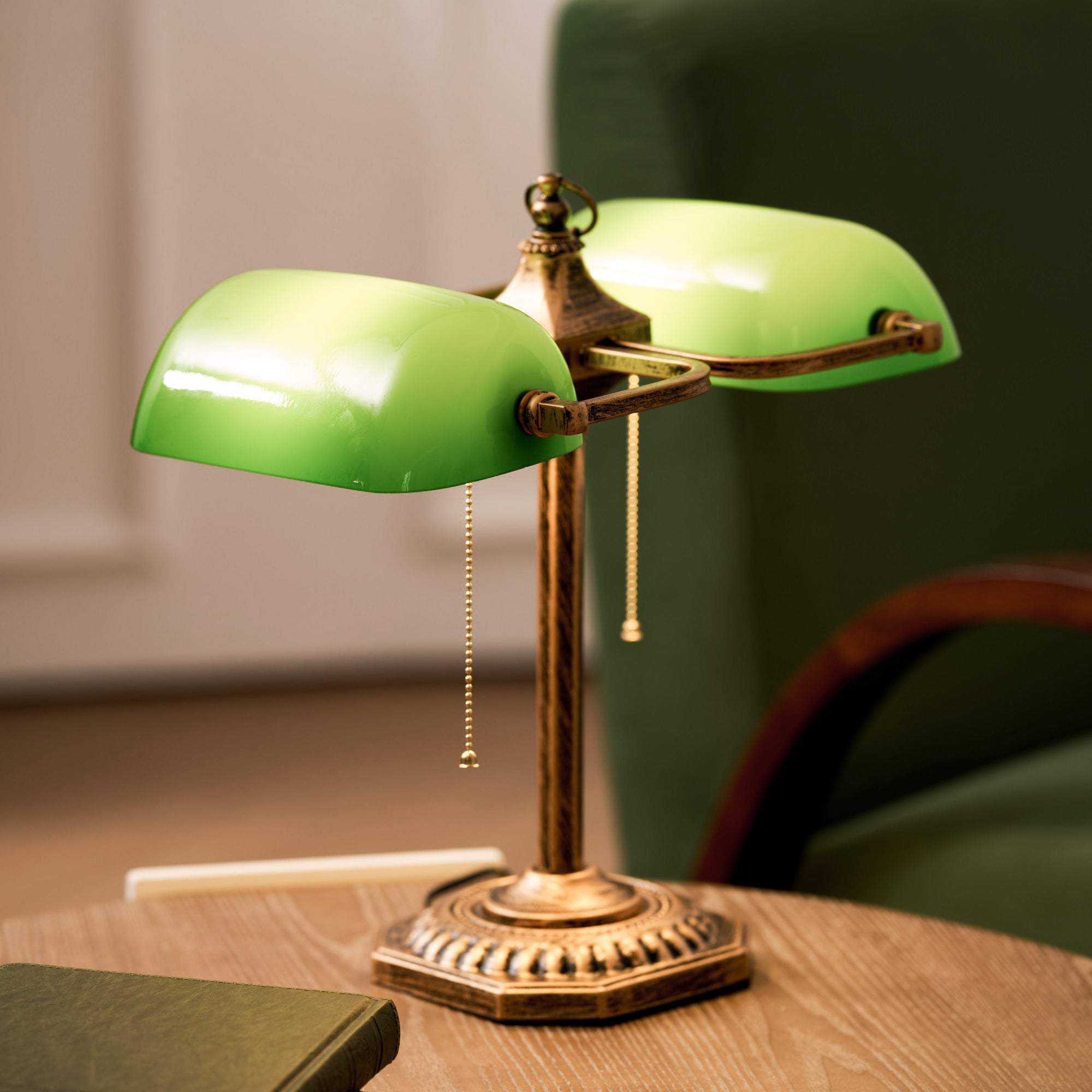 The twin library lamp shown on a vintage mahogany desk.