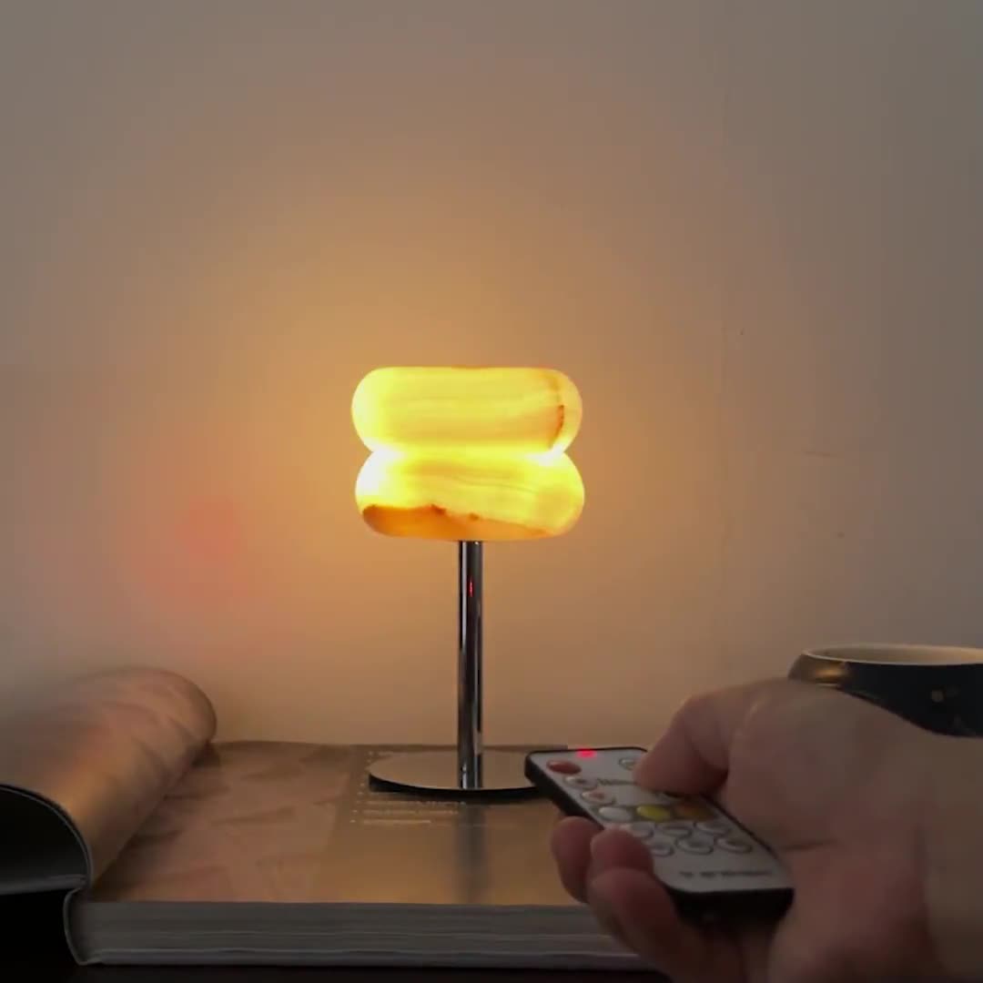 The lamp in a living room setting on an end table, adding ambient light.