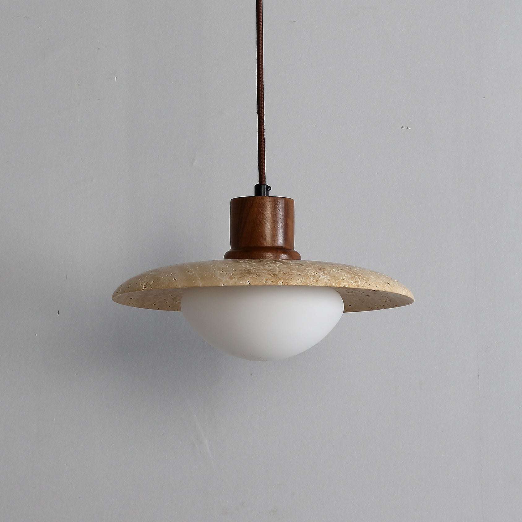 The Jadssox pendant lamp shown from a side angle against a neutral background.
