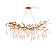 Janae Chandelier with brass arms and glass shades, viewed from the front.