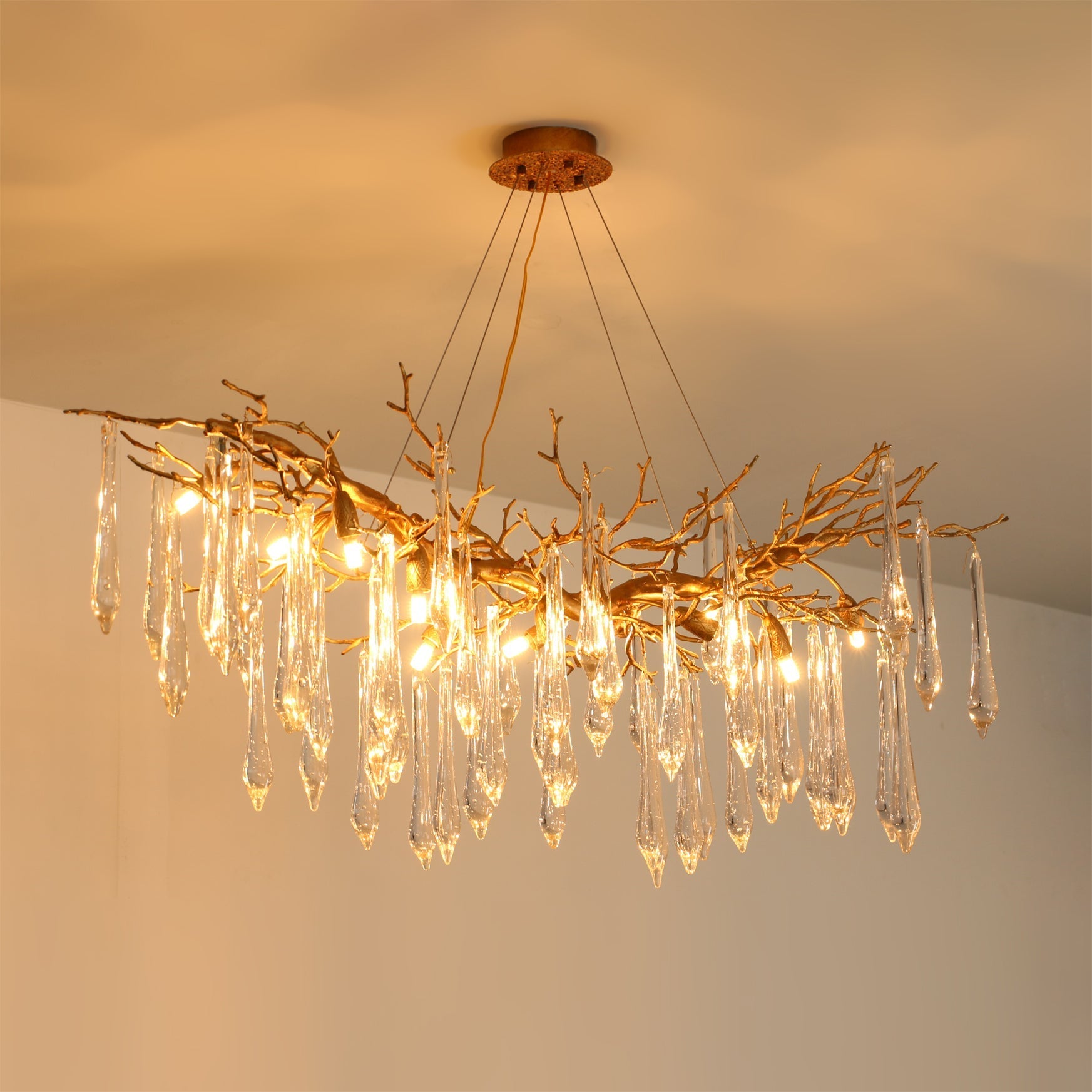 Detail shot of the G9 bulb socket within a glass shade of the Janae Chandelier.