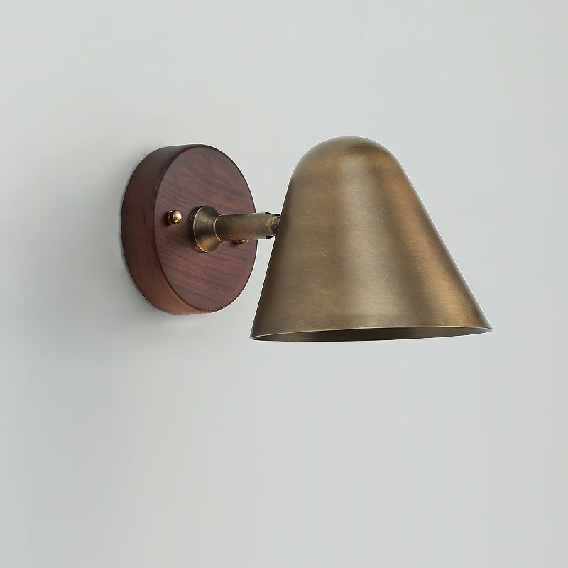 Janna Wall Lamp shown against a dark background to highlight its finish.