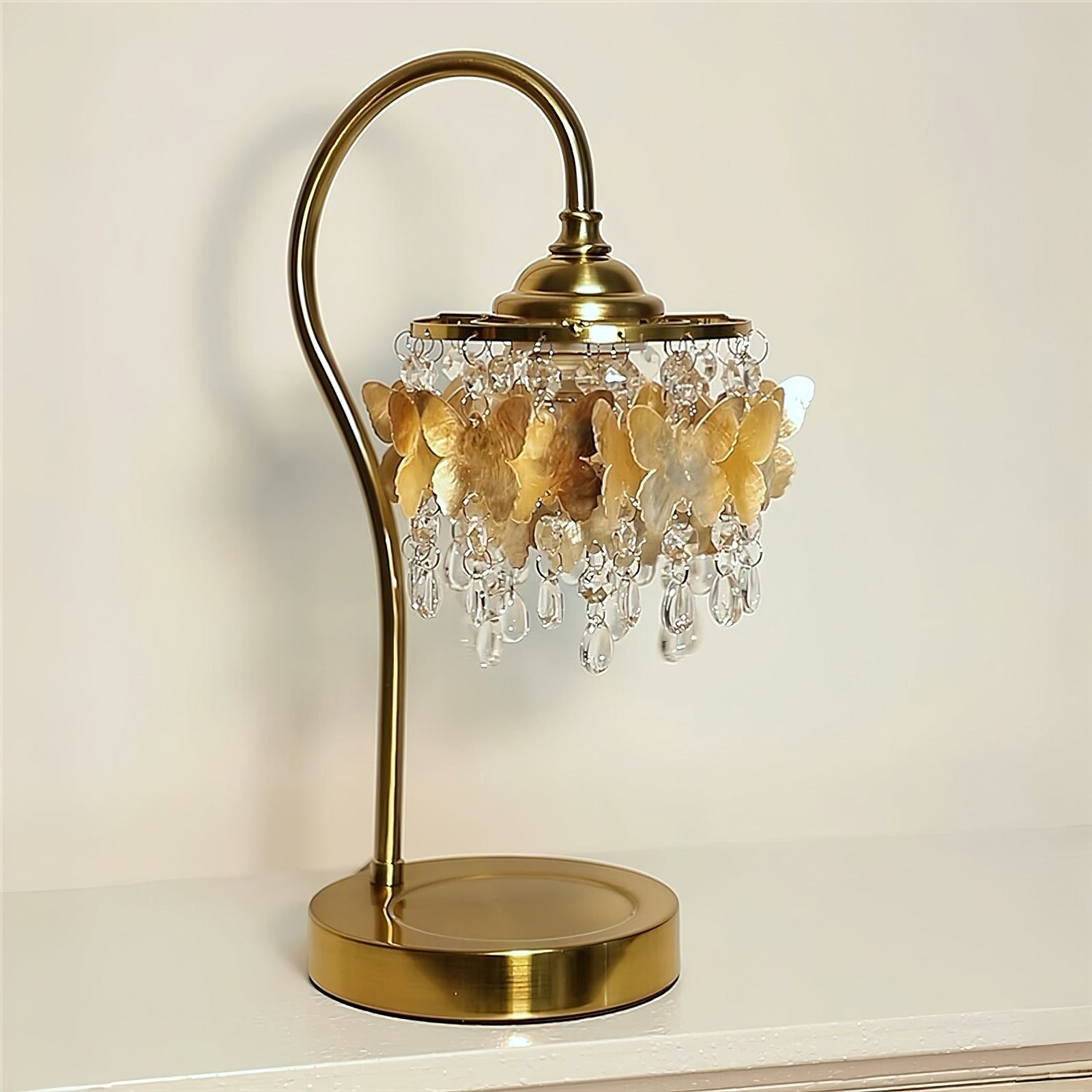 Side view of the Jasinski Table Lamp highlighting its graceful curved stand.