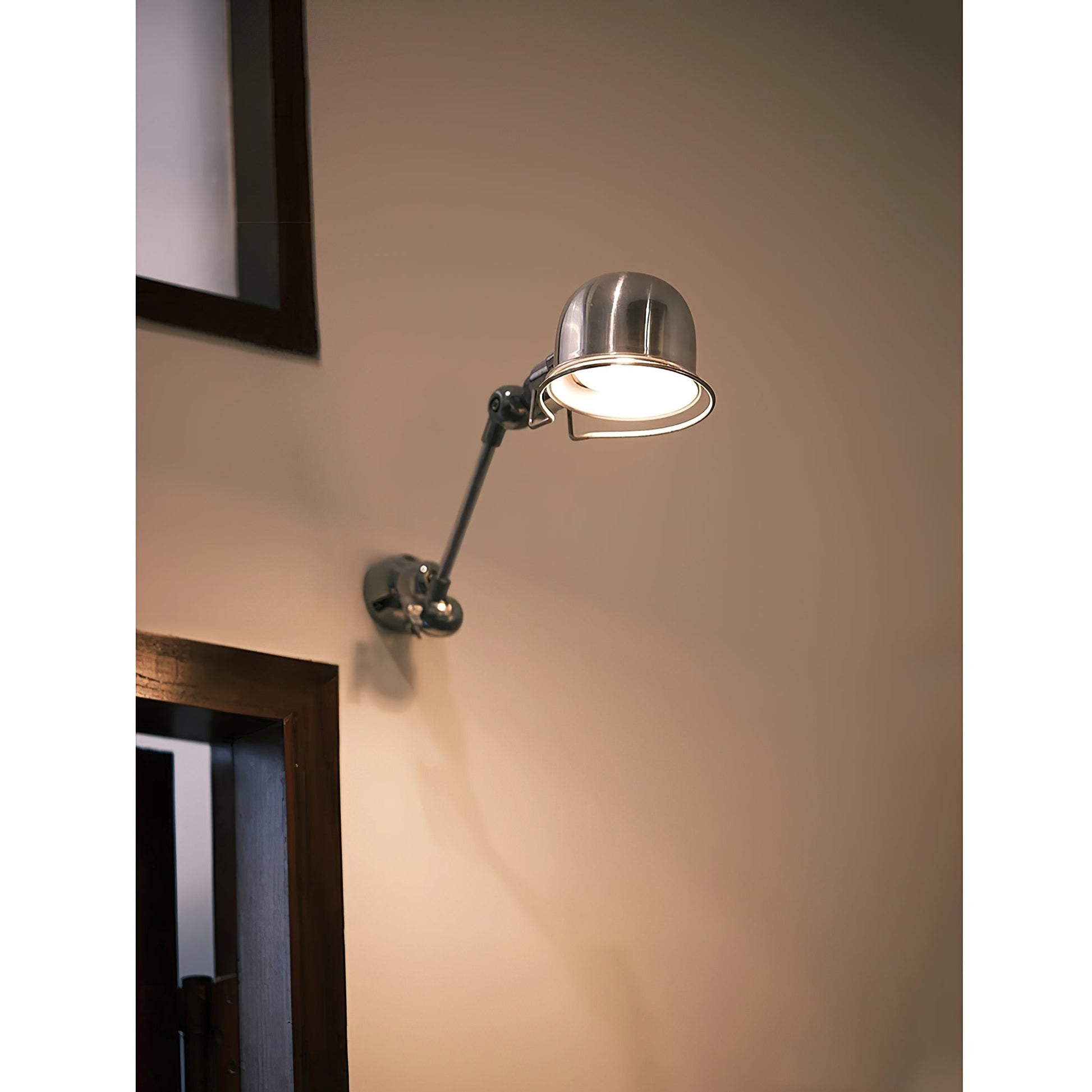 The silver wall lamp in a modern living room setting.