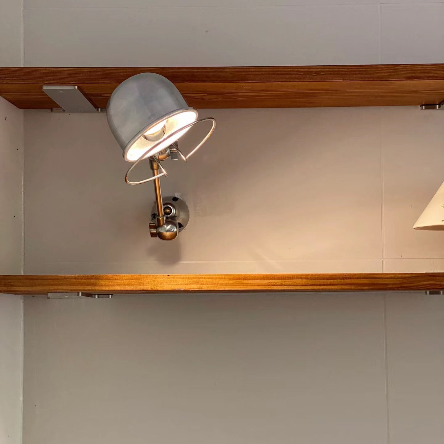 The lamp folded compactly against the wall.