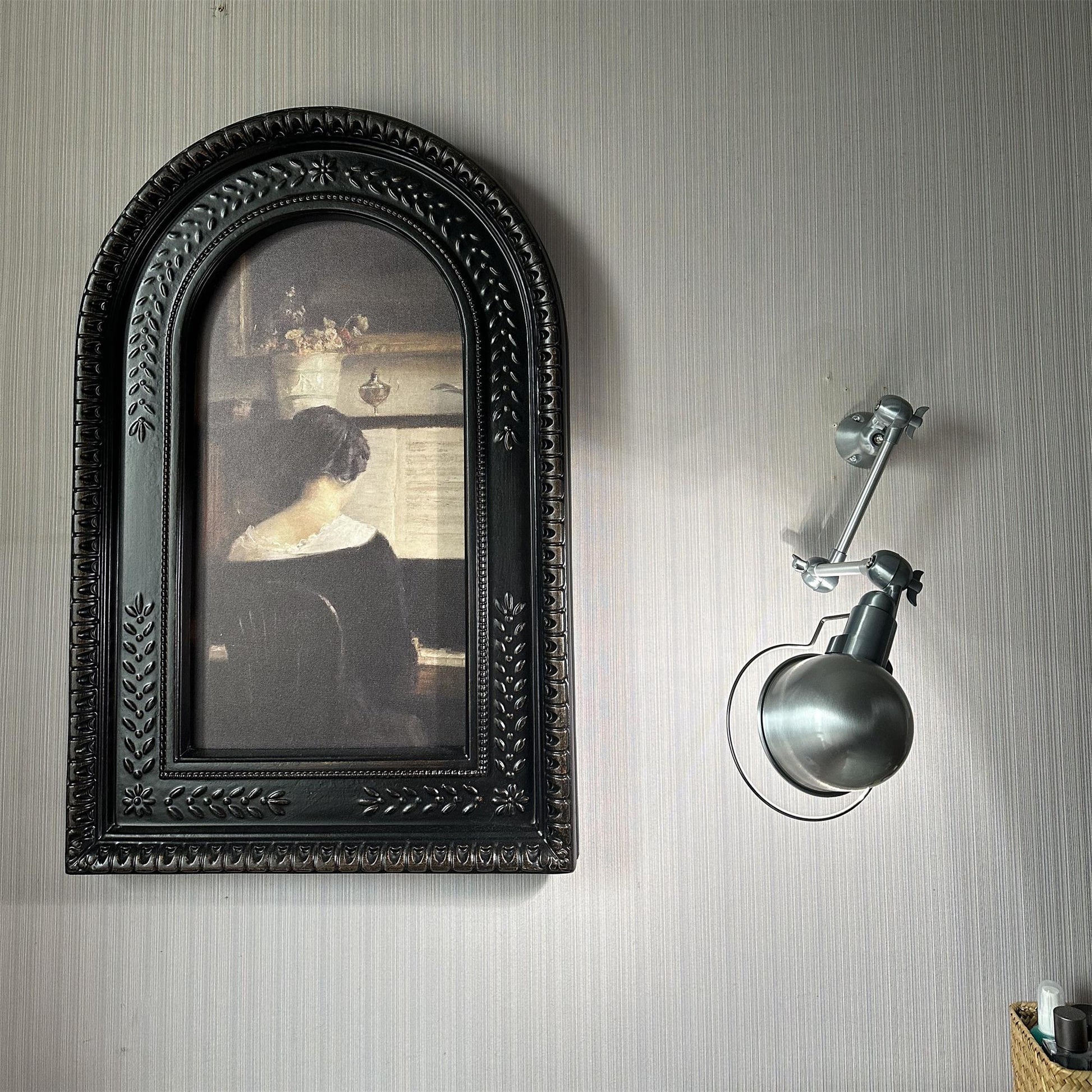 Front view of the silver industrial wall lamp.