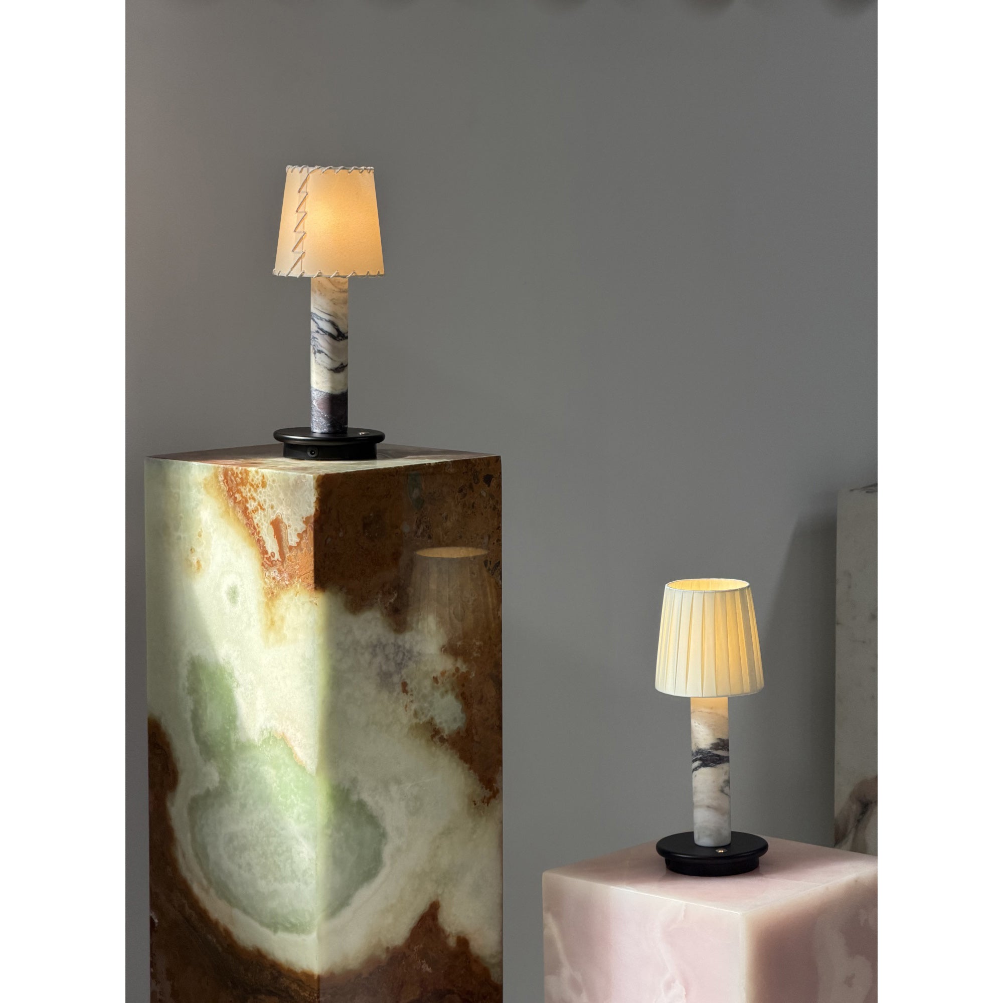 The Jorgen Table Lamp shown in all three available colors: Black, Purple, and Beige.