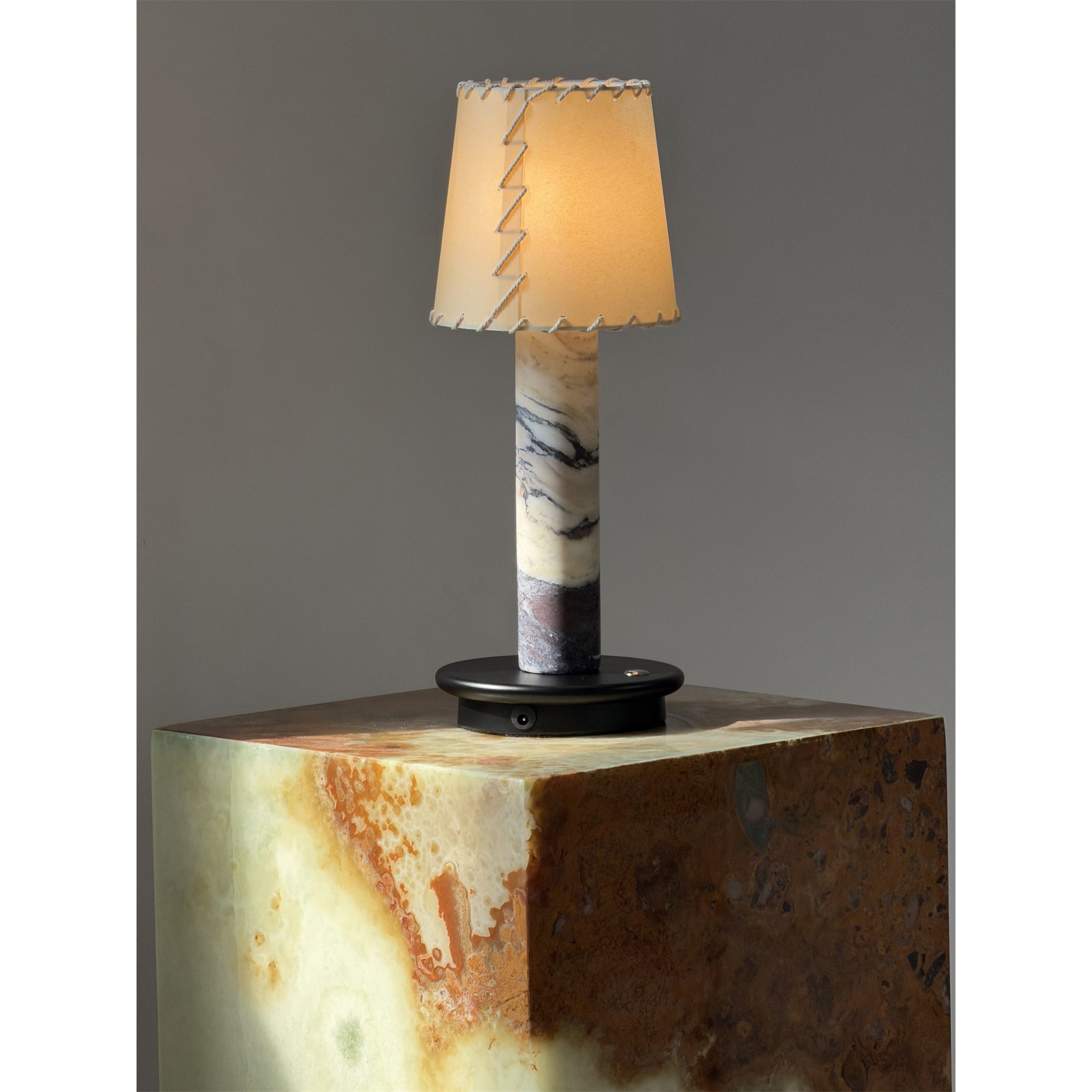 Close-up of the beige fabric lampshade texture.