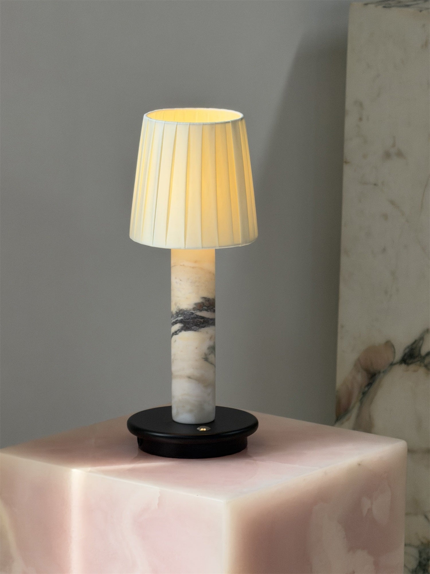 The Jorgen Table Lamp illuminating a living room accent table.