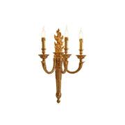 Julienne Wall Lamp in brass with a torch flame design.