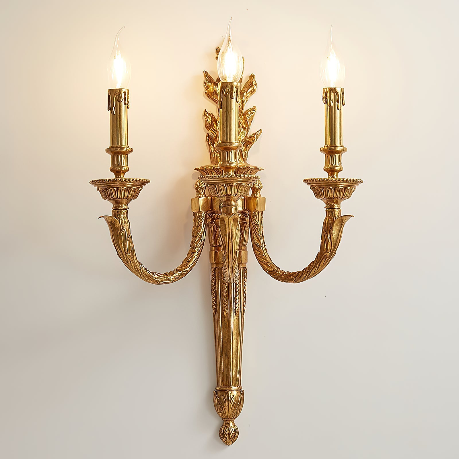 The three individual light heads of the Julienne Wall Lamp.