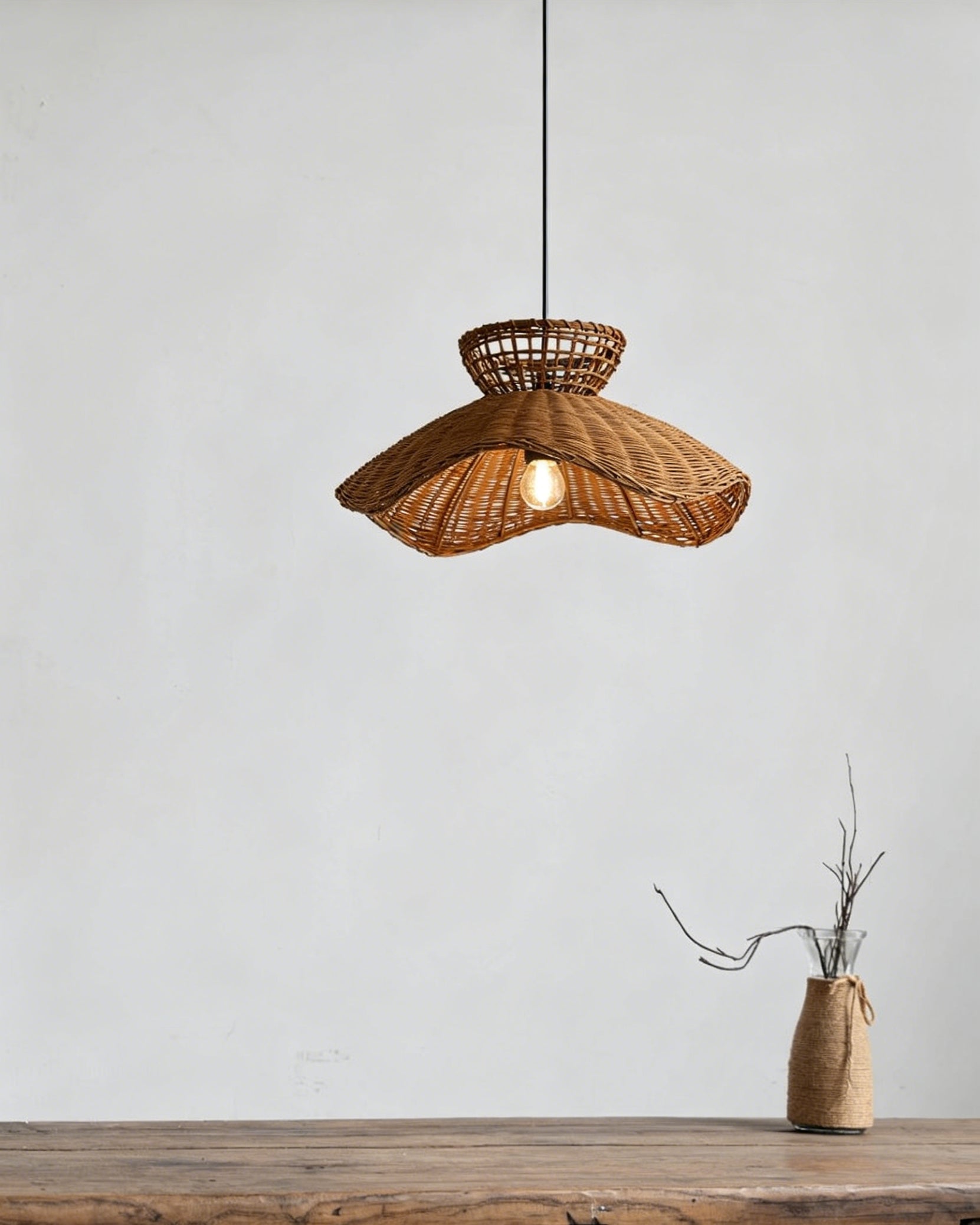 Close-up detail of the handwoven rattan shade of the Jumbo Pendant Light.