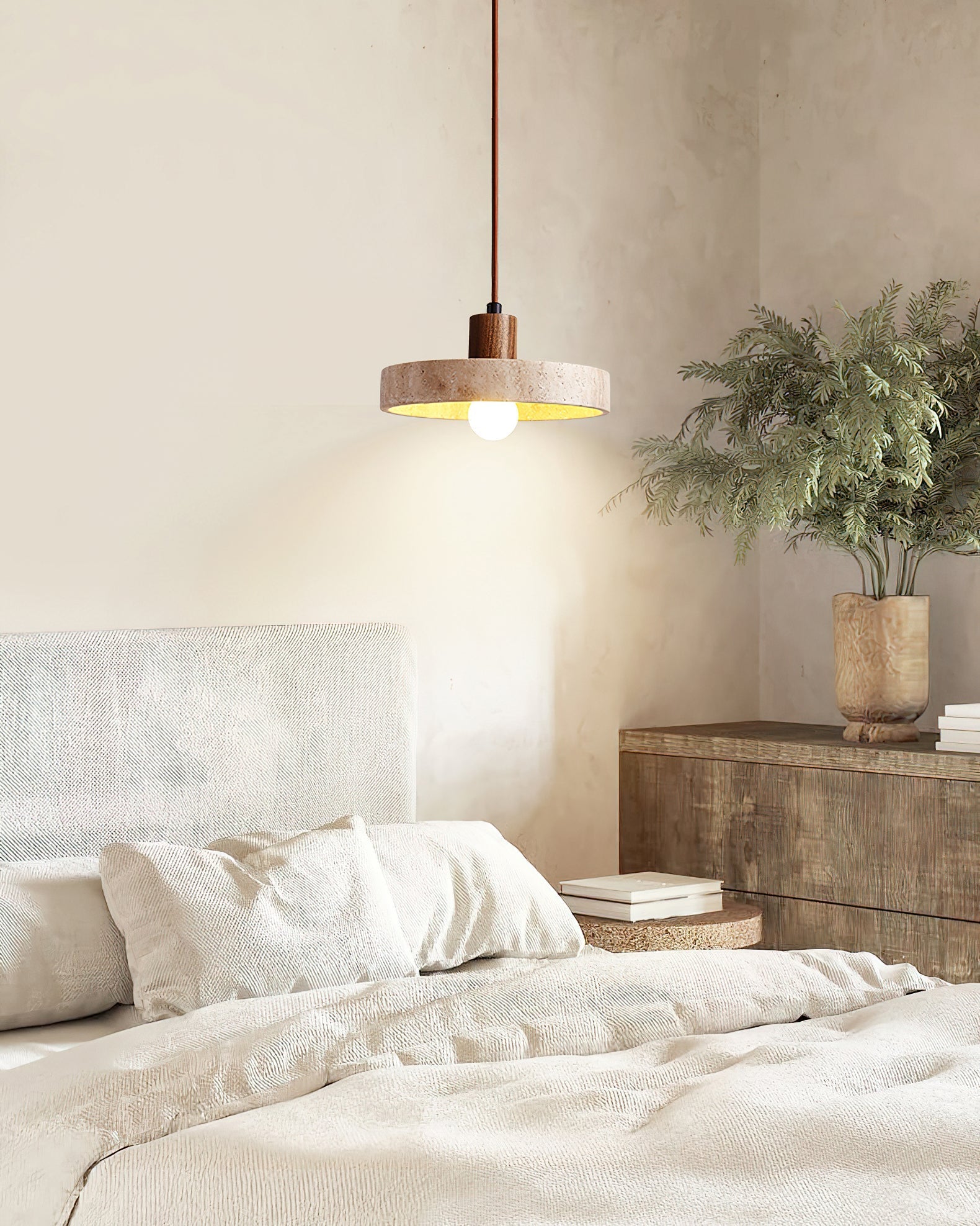 The Kairi Pendant Lamp emitting a soft, warm glow.