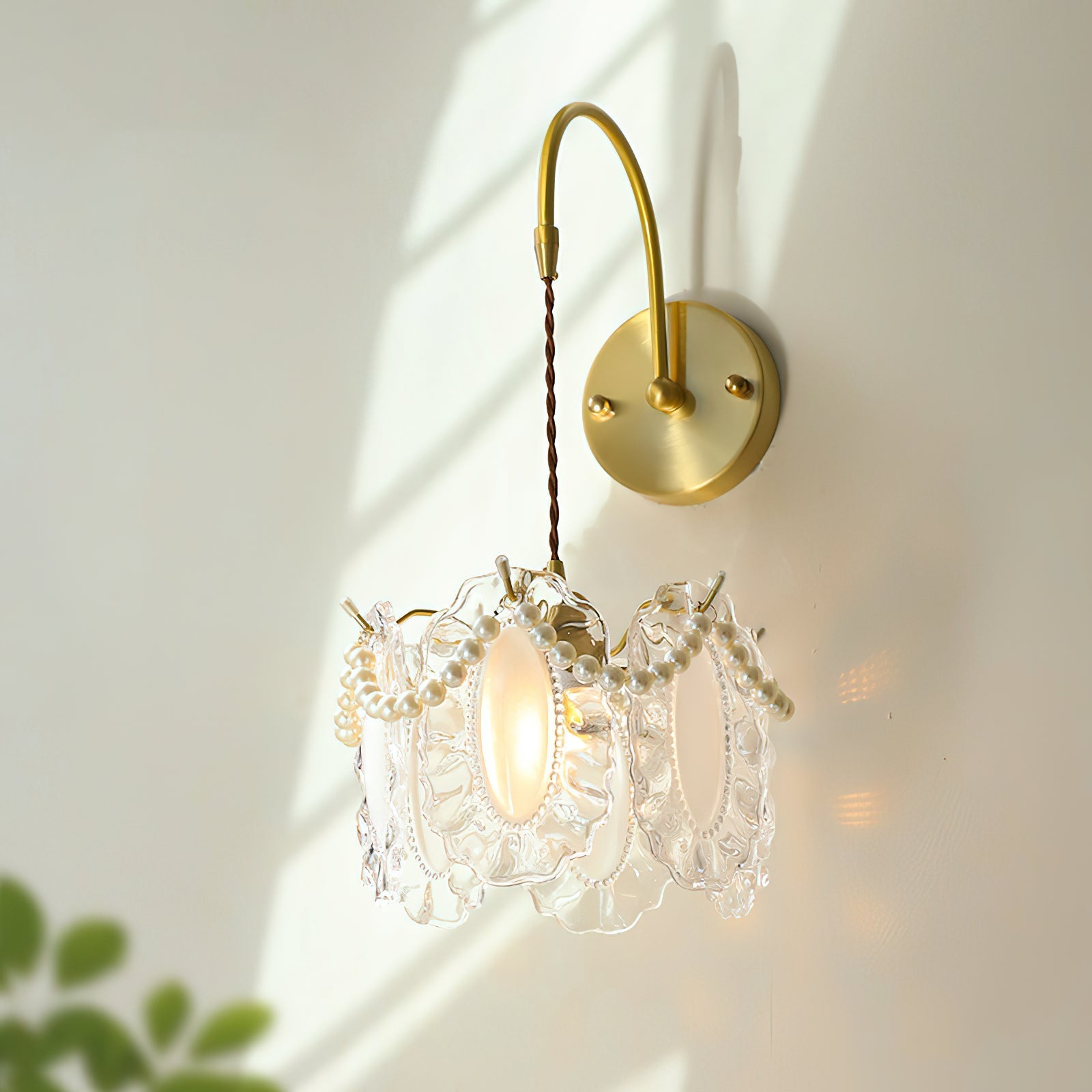 Angled view of the Kano Glass Wall Light showcasing its form.