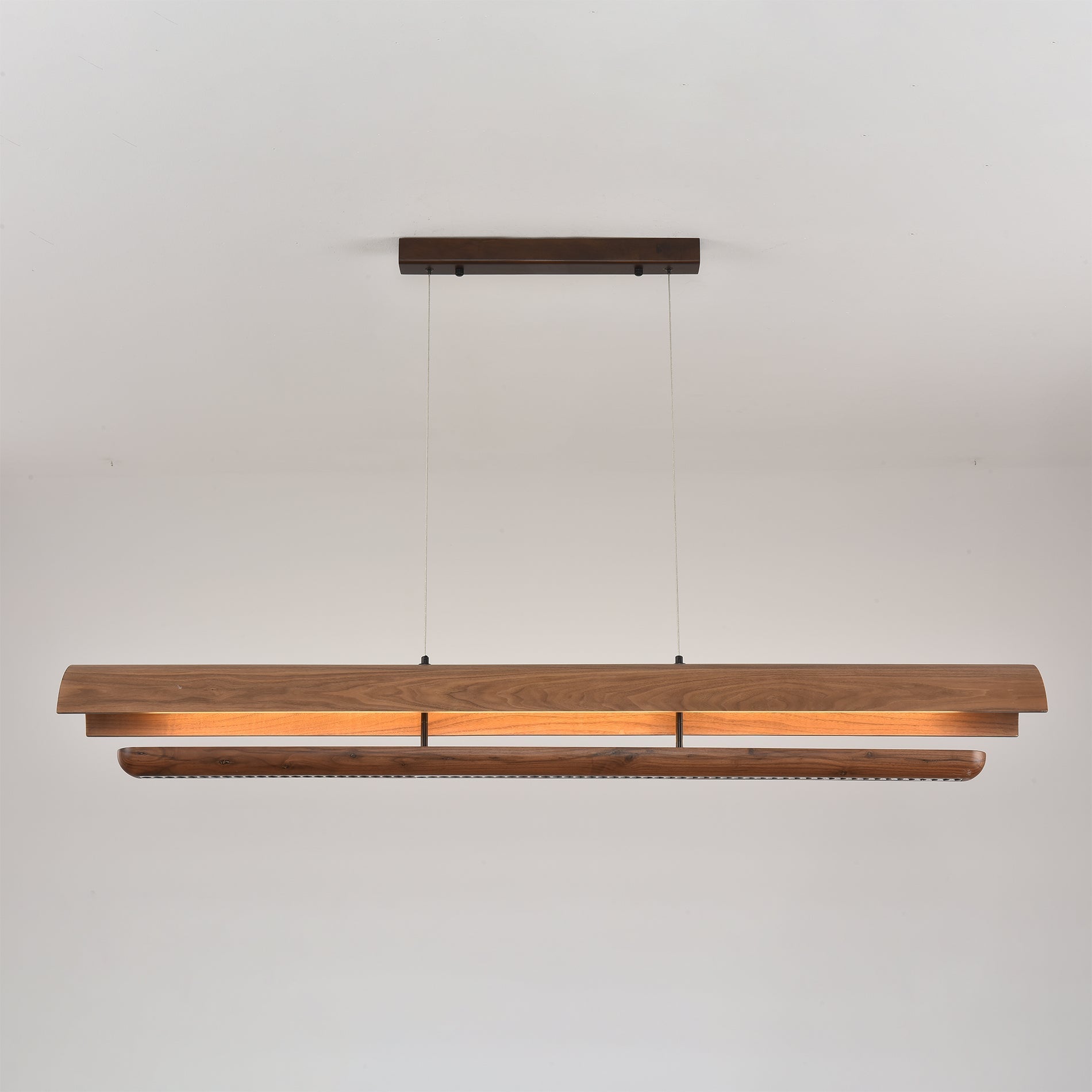 Detail shot of the walnut wood grain on the Kanoe chandelier.