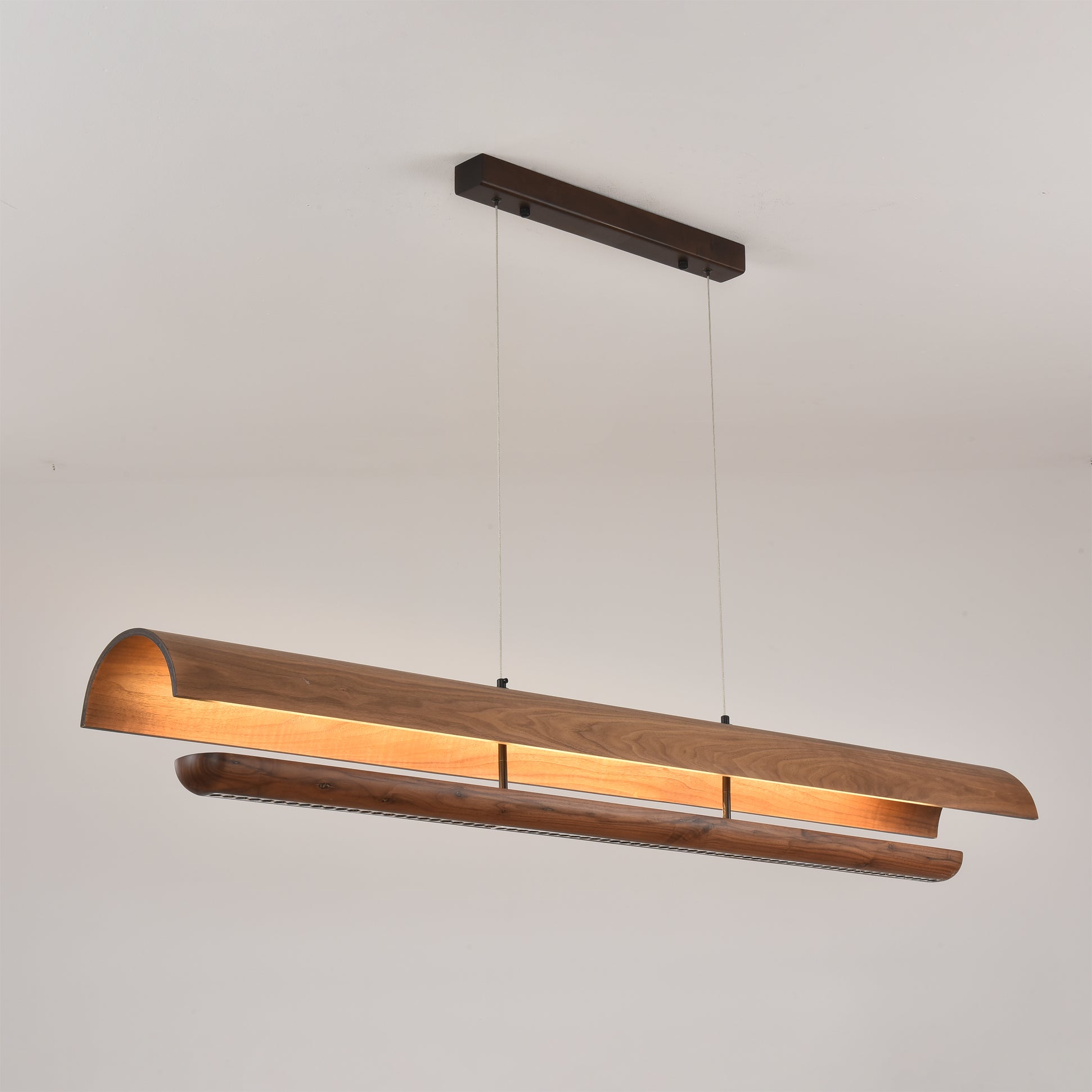 The Kanoe Linear Chandelier shown in its medium size option.