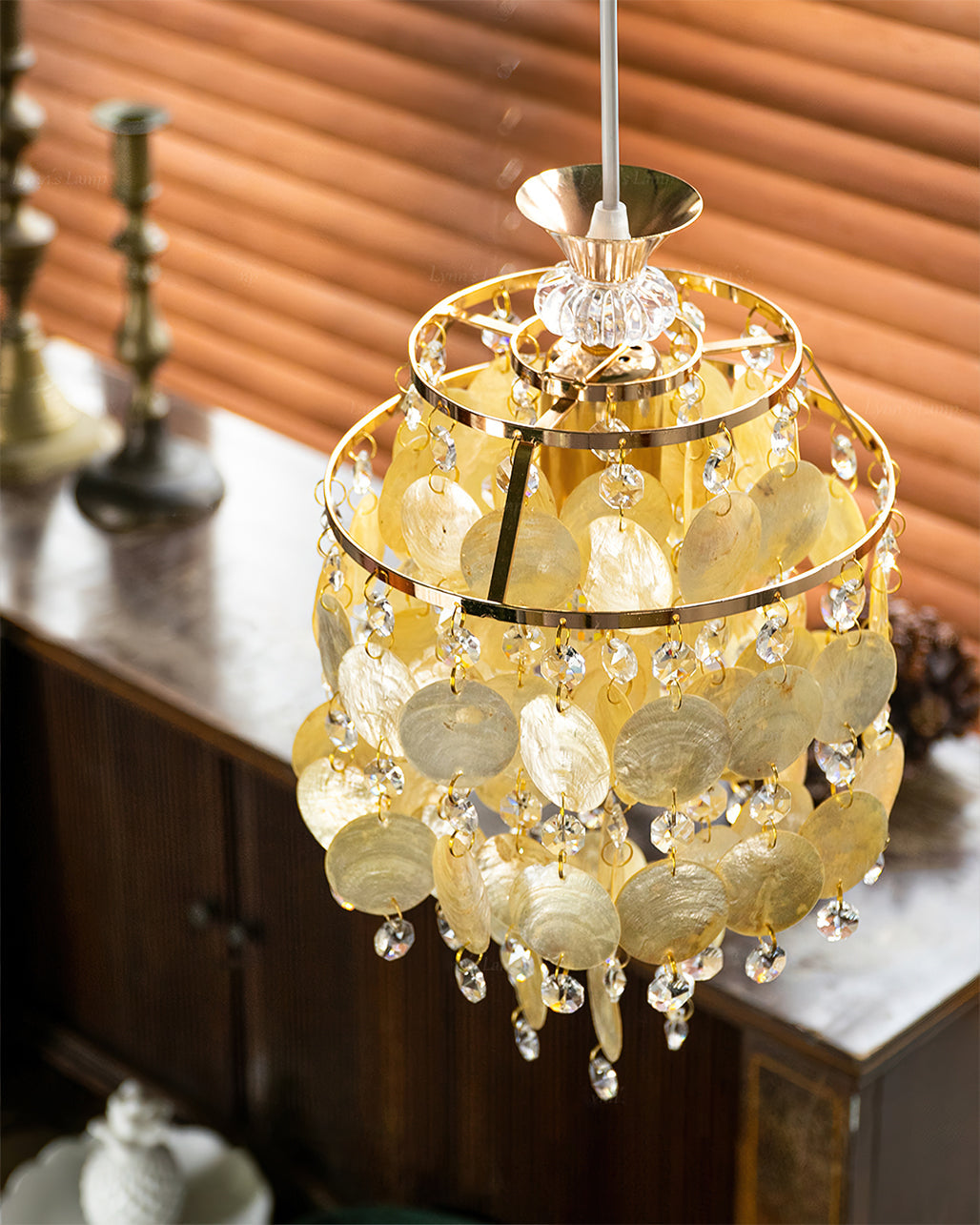 Katinka Pendant Light shown in a bedroom setting.