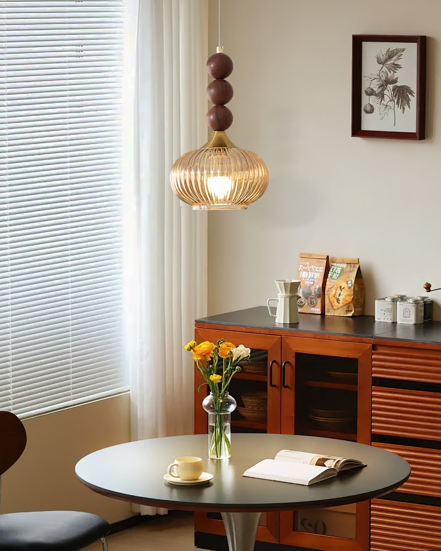 Side view of the amber and gold Kaydan Pendant Lamp against a neutral background.