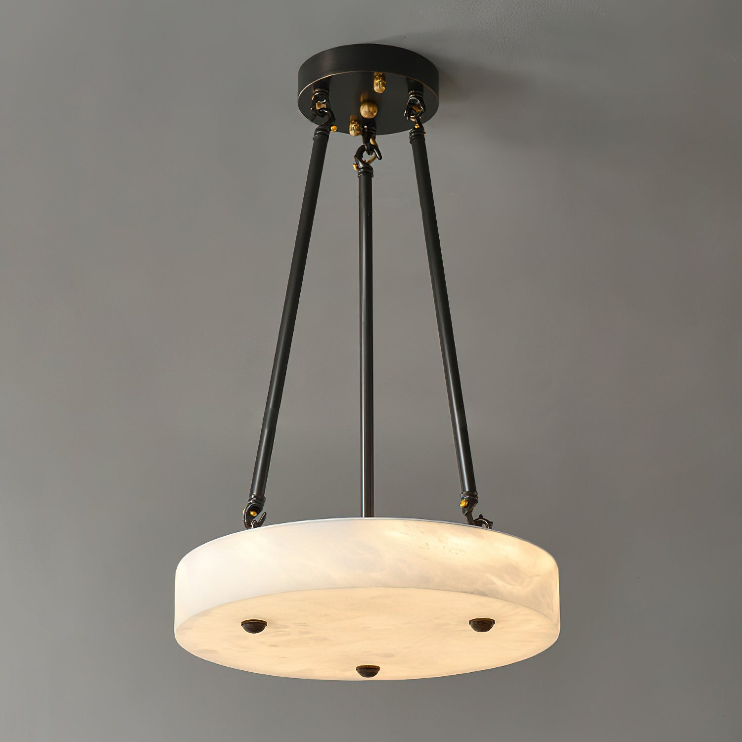 Kayme Alabaster Pendant Lamp shown in a modern living room setting.