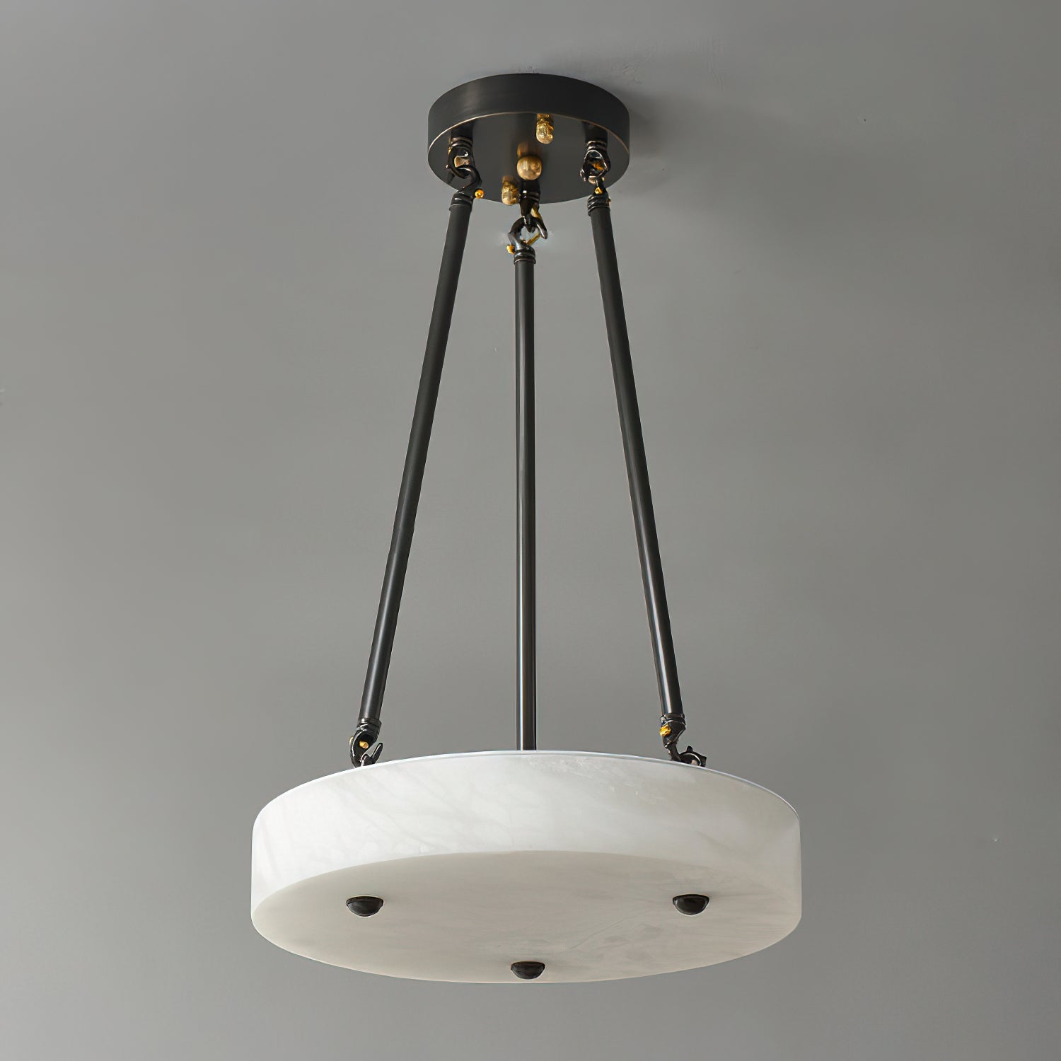 Close-up view of the natural veining on the alabaster shade of the Kayme pendant lamp.