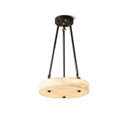 Kayme Alabaster Pendant Lamp with a drum-style shade and dark brass suspension.