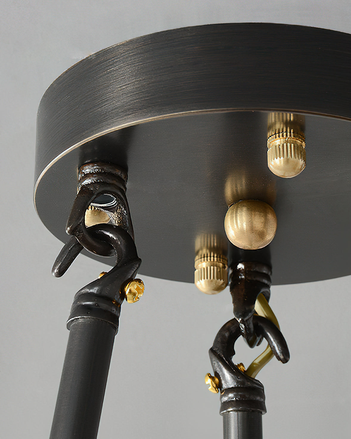 Detail shot of the darkened brass rods connecting to the alabaster shade.