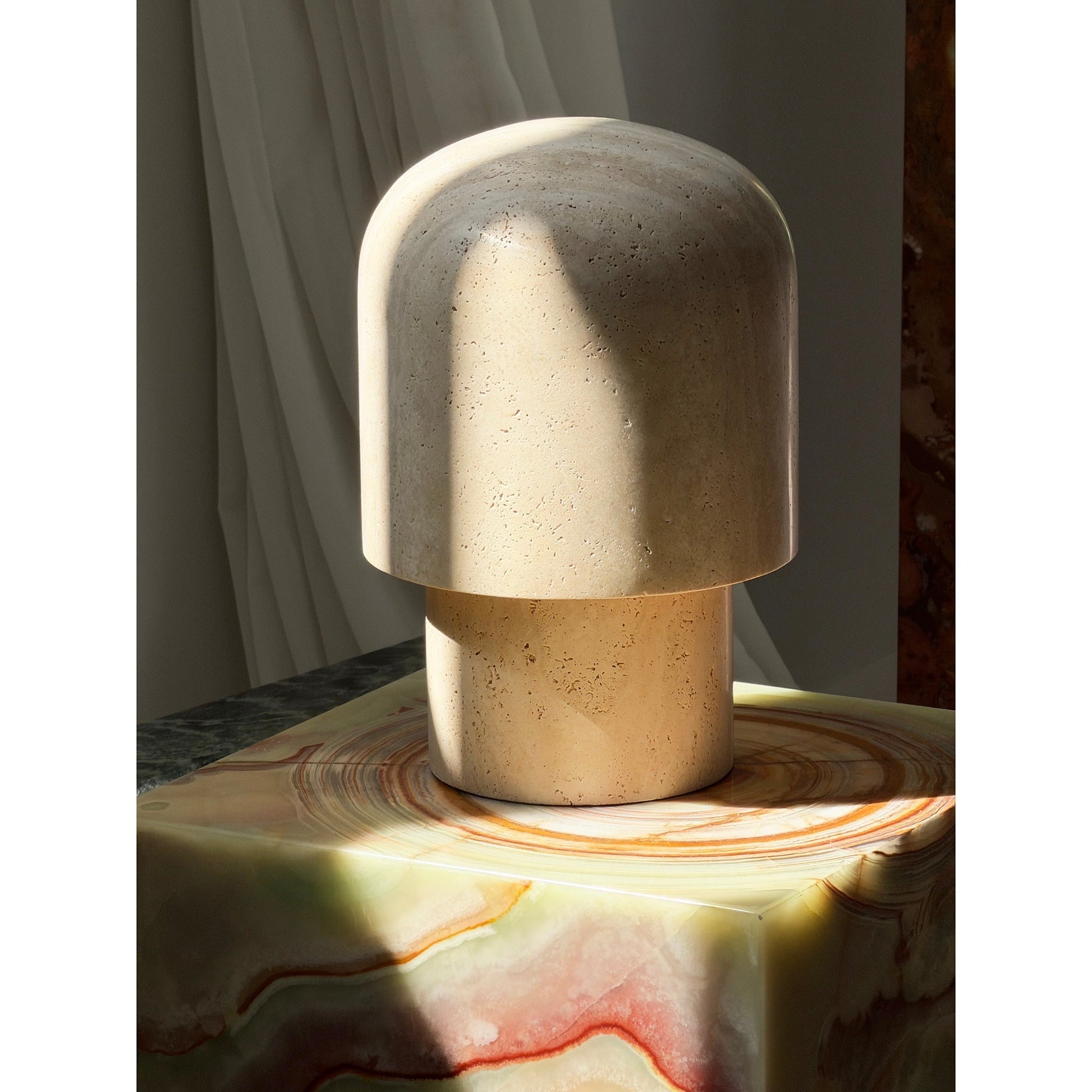 Detail shot of the lamp's warm, earthy tones and unique travertine patterns.