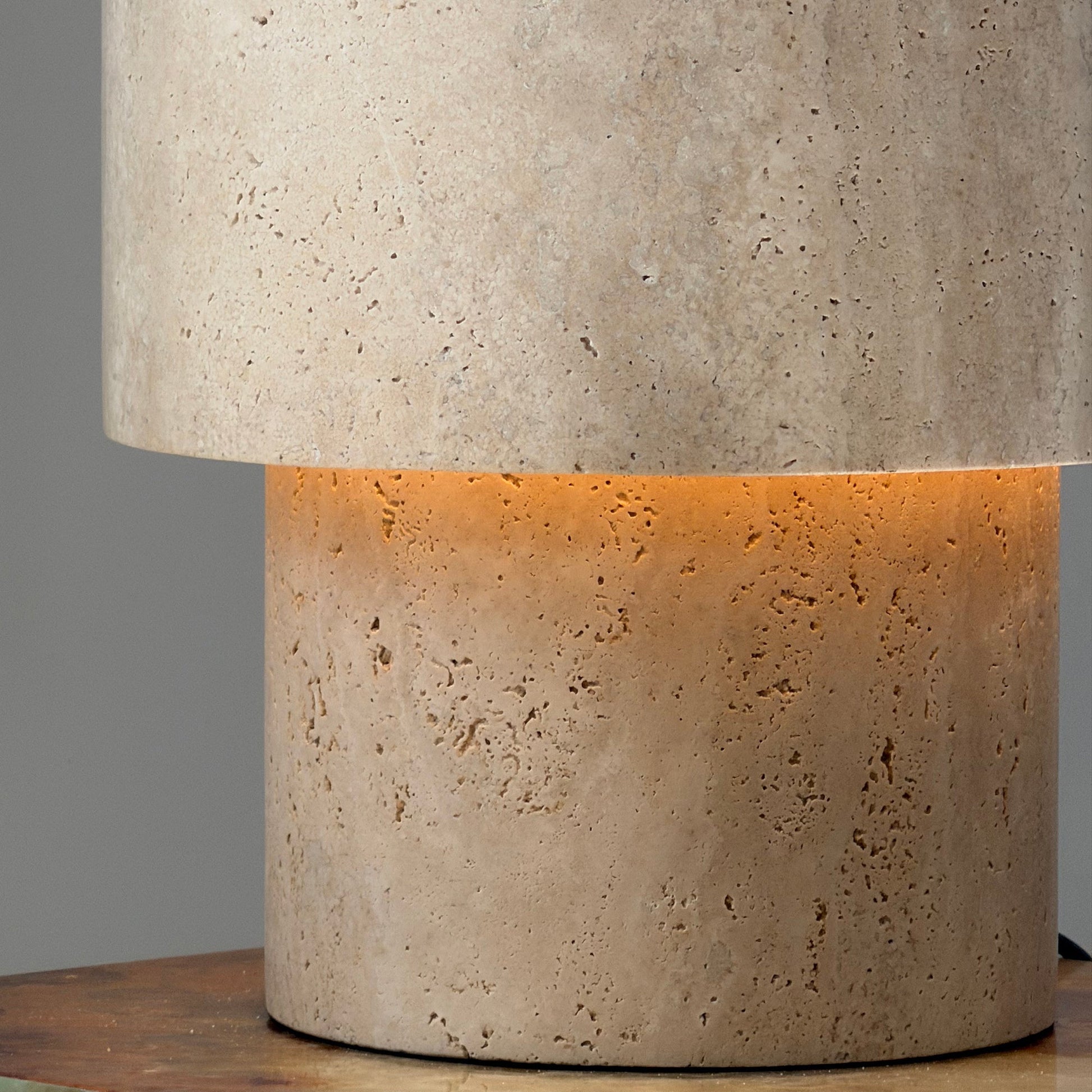 The Kennett Travertine Table Lamp shown unlit to showcase its sculptural form.