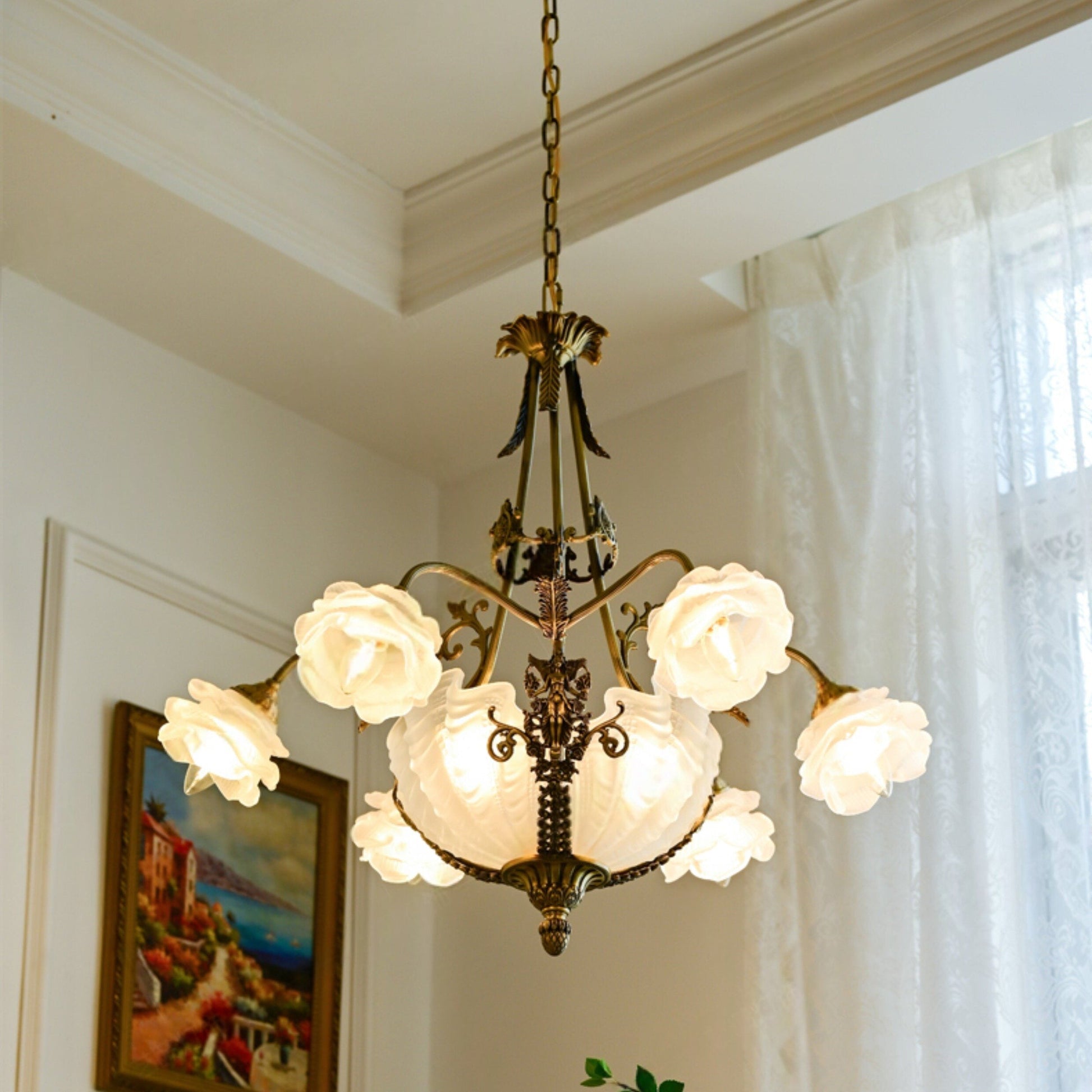 Close-up of the frosted rose glass shades on the Victorian-style chandelier.