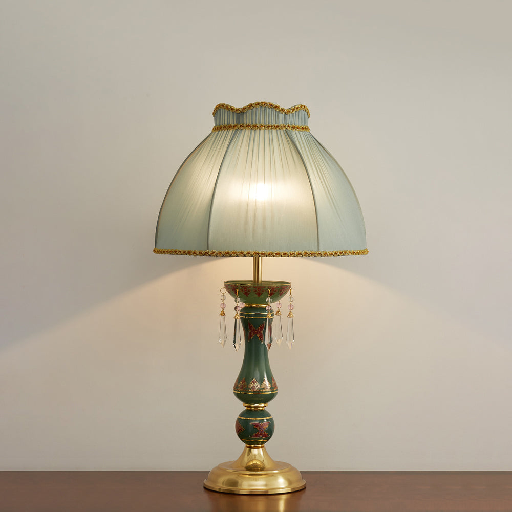 The warm ambient glow from the Kenton Table Lamp's fabric shade.
