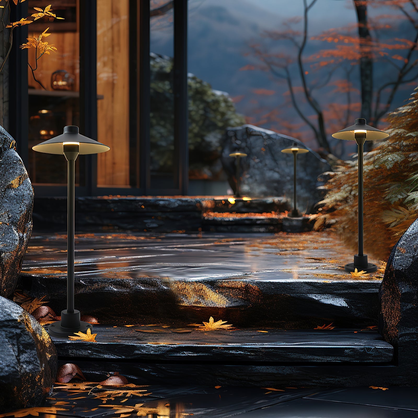 The outdoor table lamp illuminated at dusk, casting a warm glow.