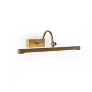Kingsbury Linear Brass Wall Sconce mounted above a modern bathroom vanity.